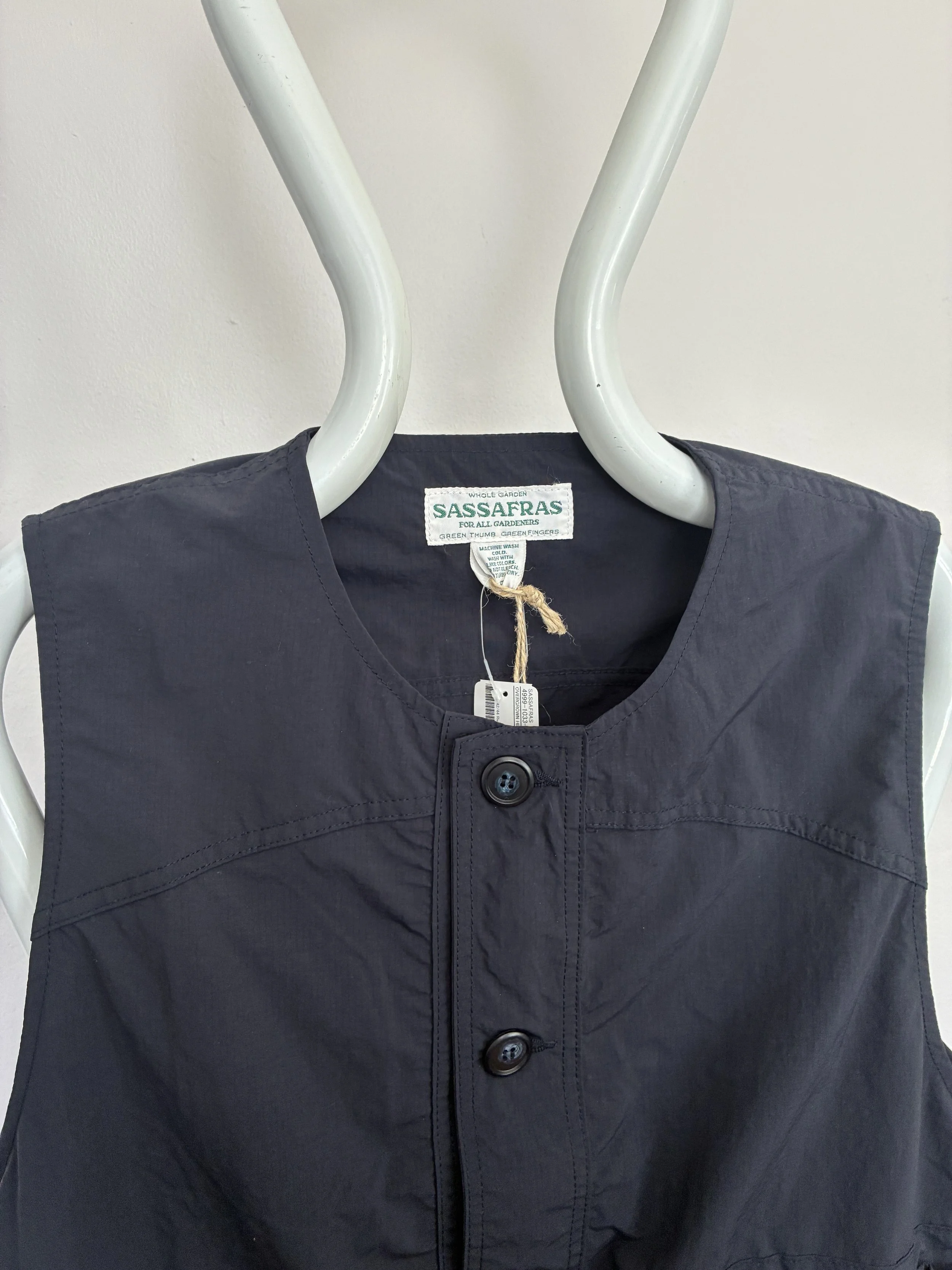 Closeup of Navy Sassafras Overgrown Hiker Vest on mannequin