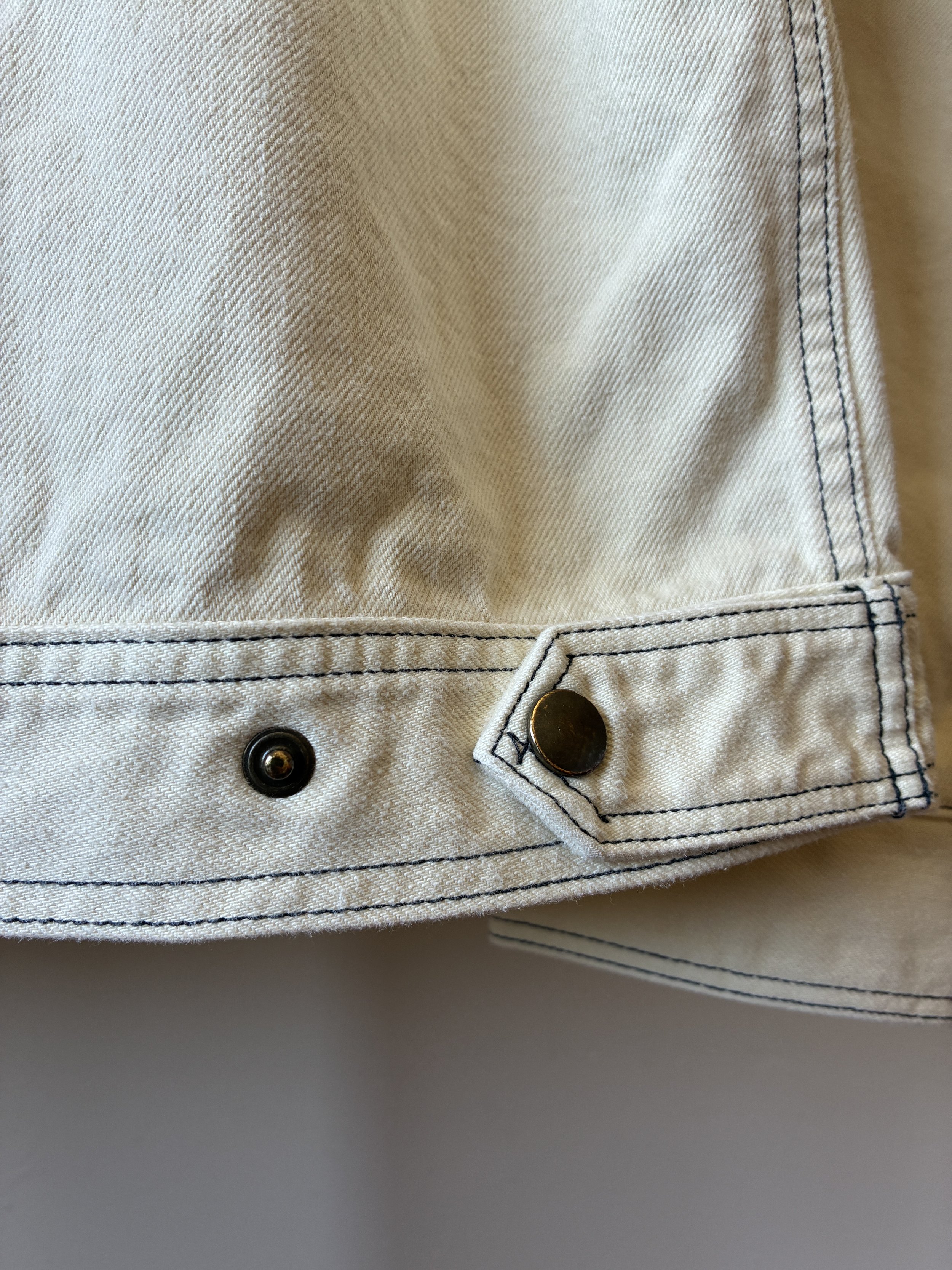 Brass buttons on Working Skewed jacket