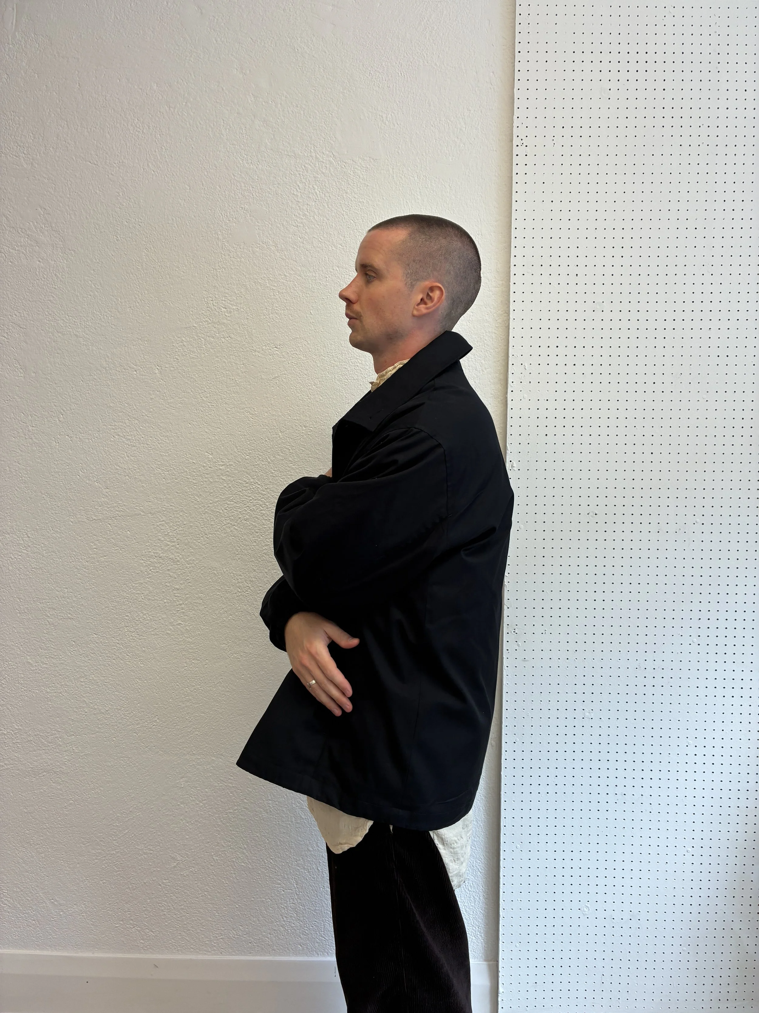 Side of man wearing Navy De Dam Foundation Cotton Gabardine Jacket
