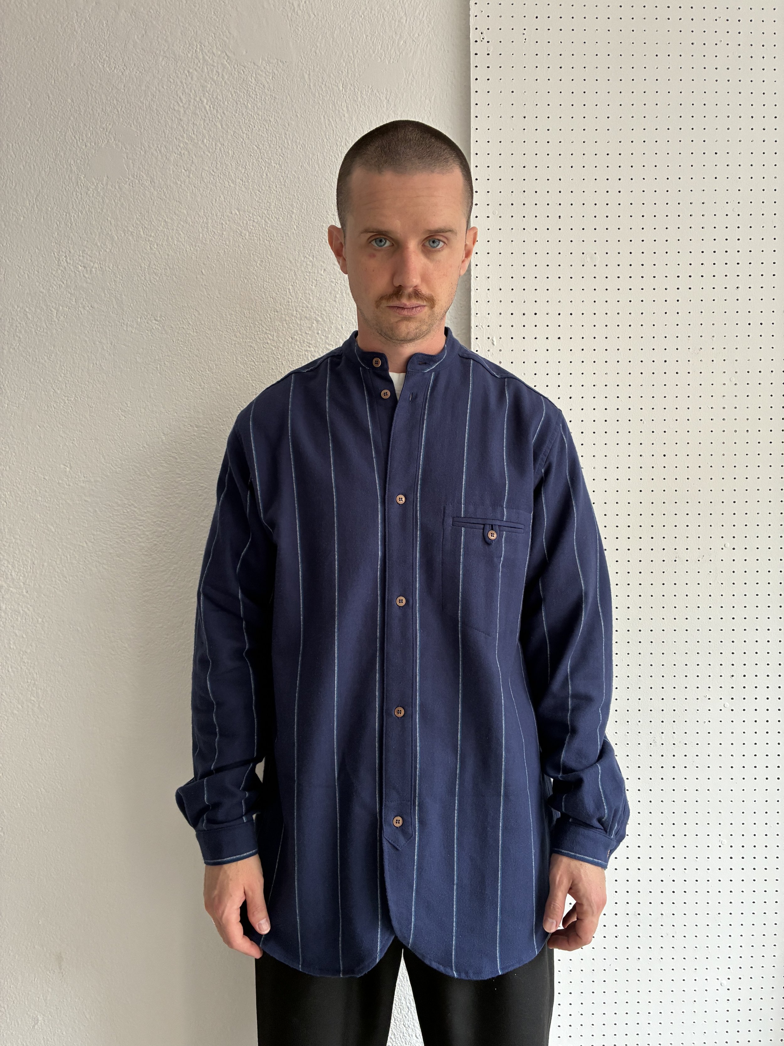 Model wears a Frank Leder navy striped shirt