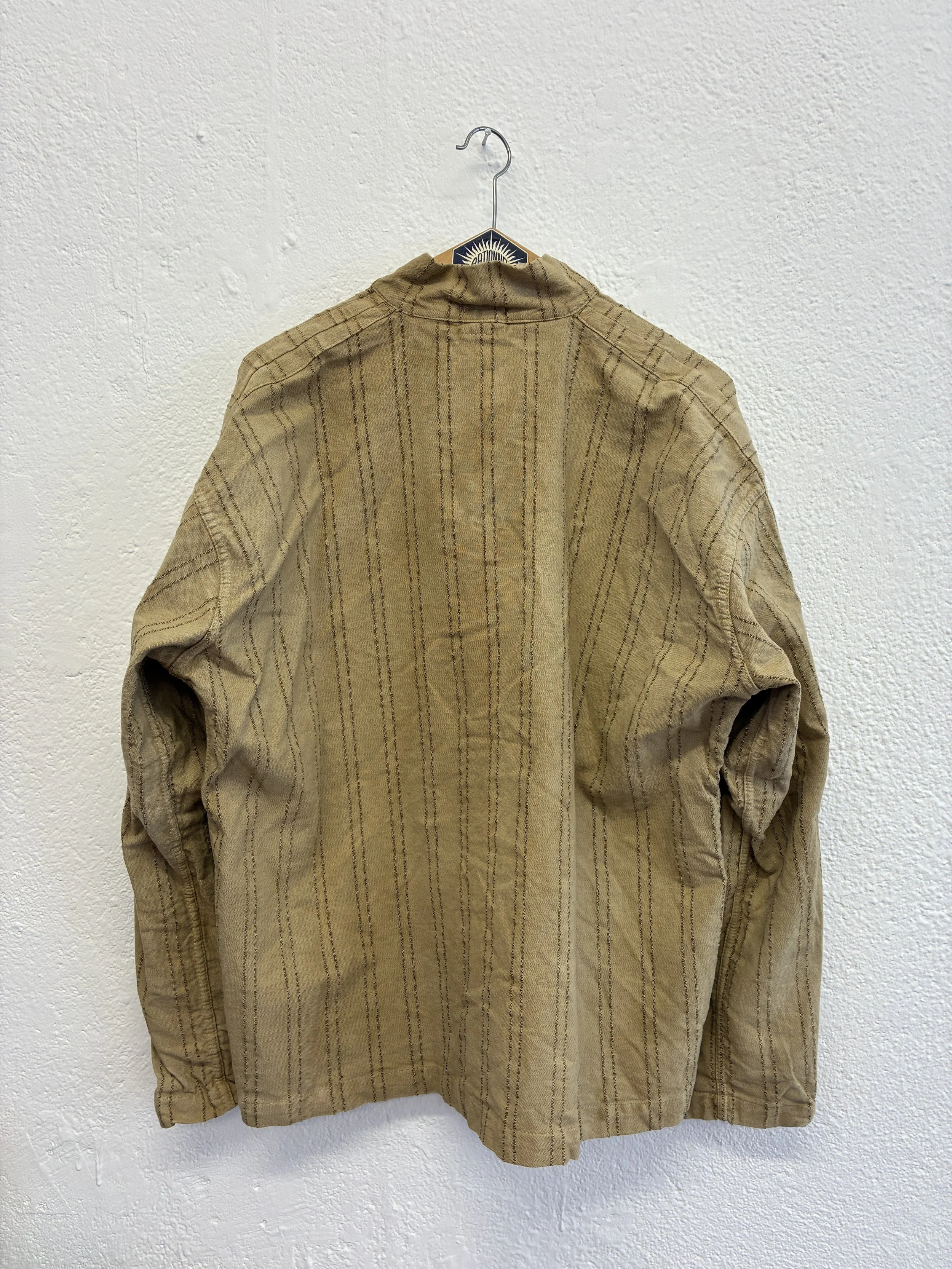 Back of Drab Weld Tender Co Type 485 Isosceles Shirt on hanger