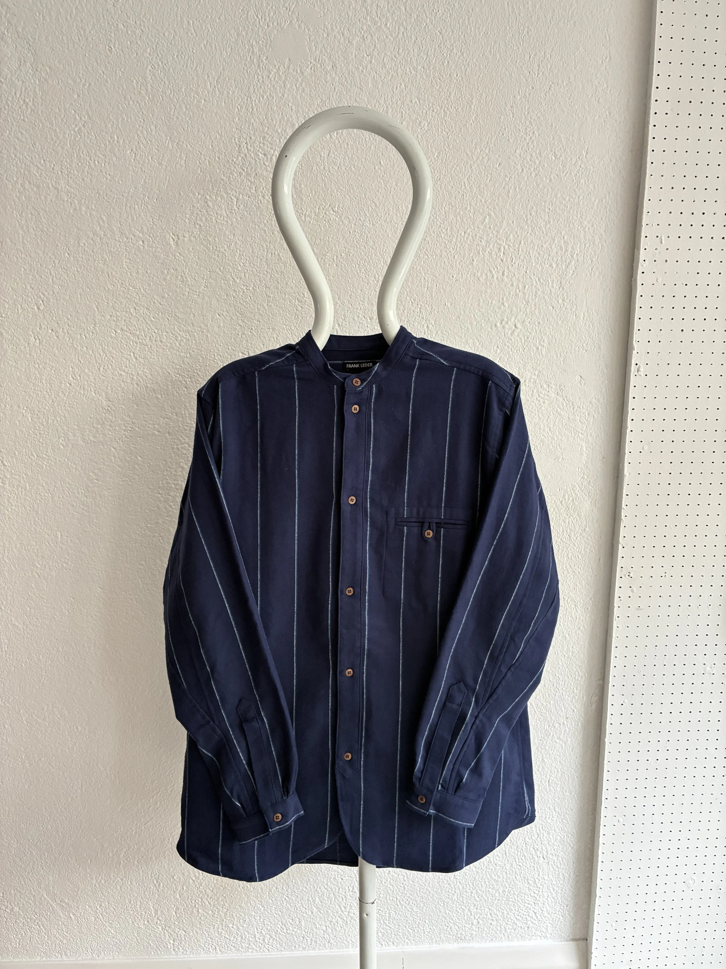 Mannequin wears a Frank Leder navy striped shirt