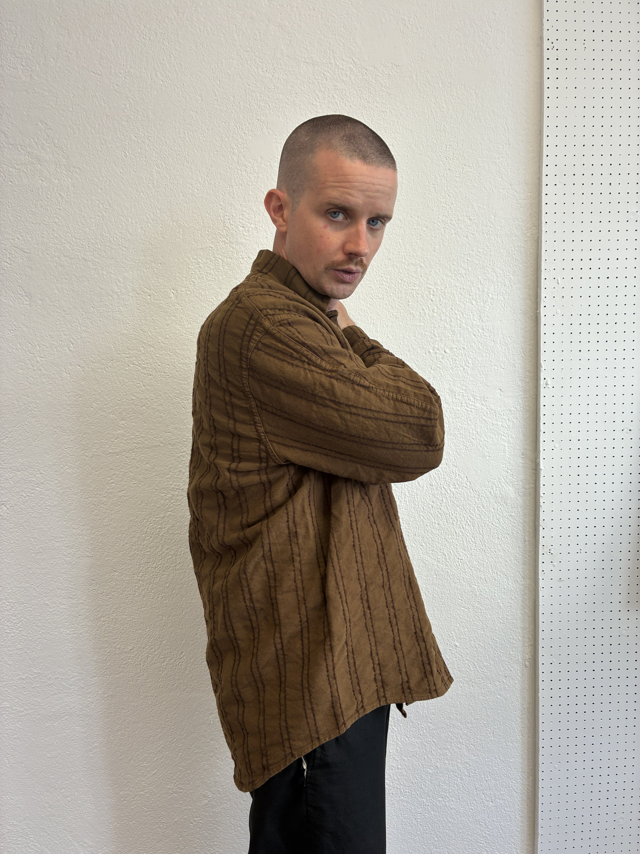 Side of man wearing Brown Tender Co Type 486 Burro Shirt