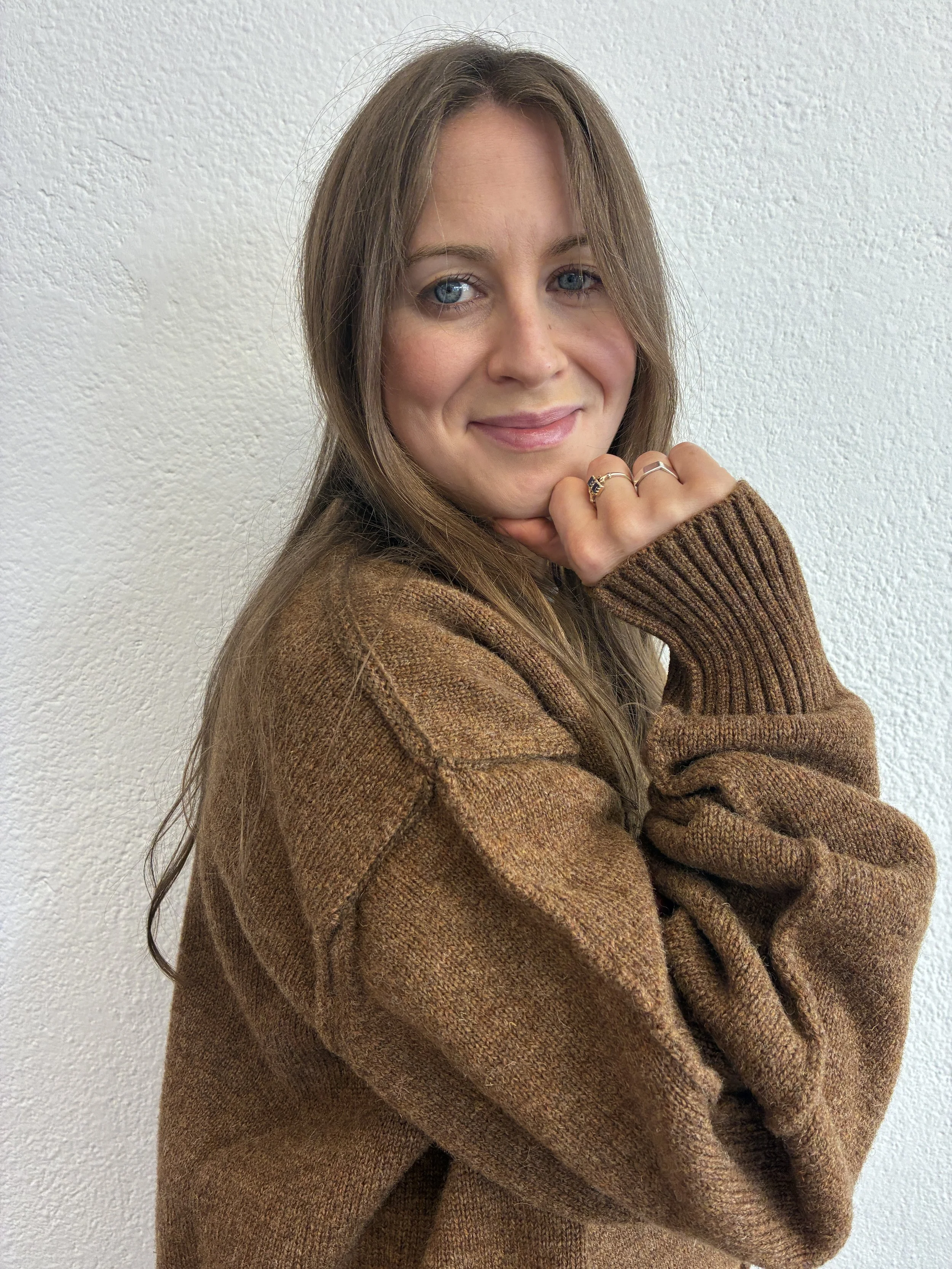 Closeup of woman smiling wearing Brown Tender Co Type 719 Butterfly Jumper