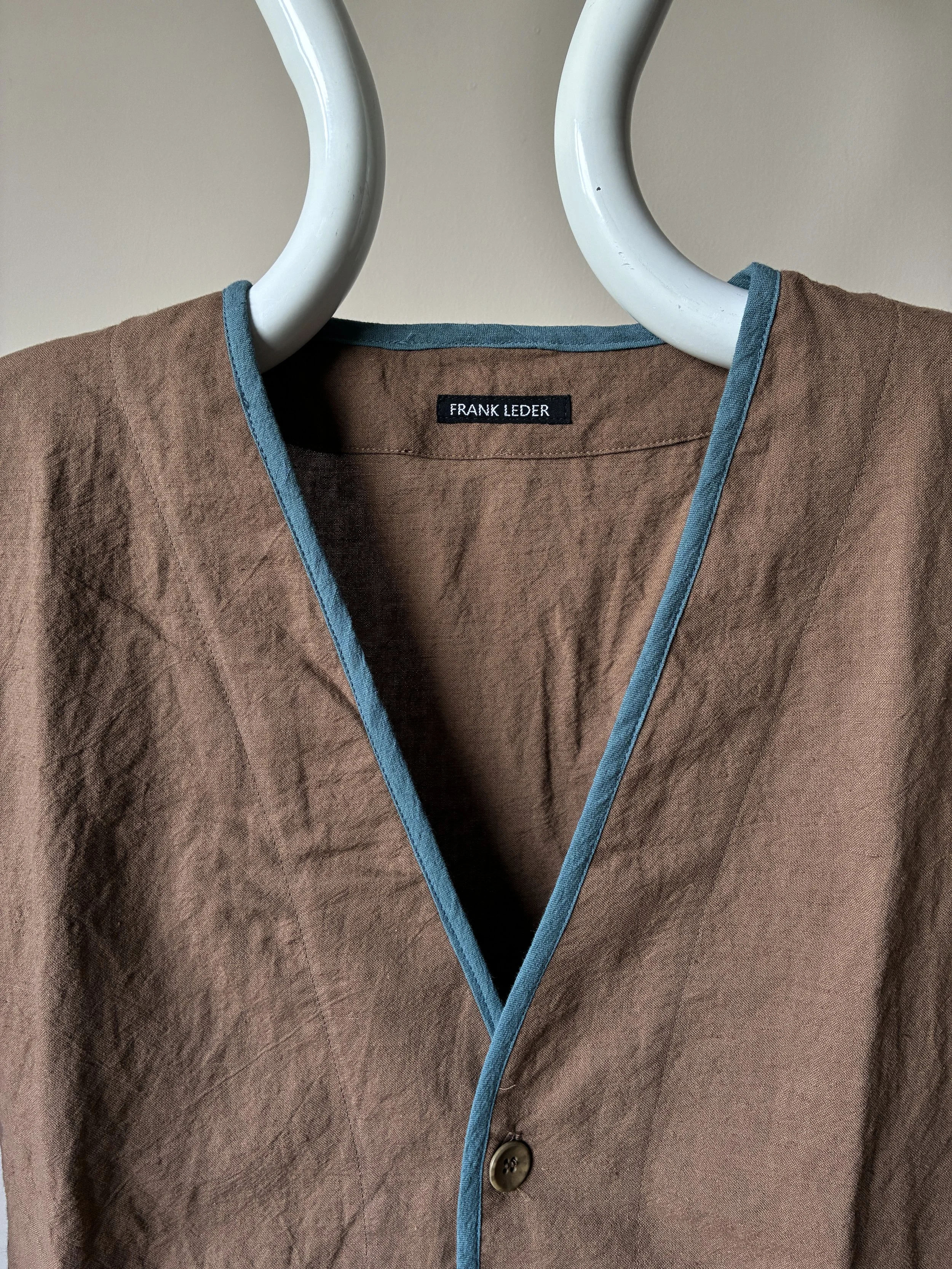 Close up of Frank Leder Linen Cotton Brown Teal Jacket on mannequin