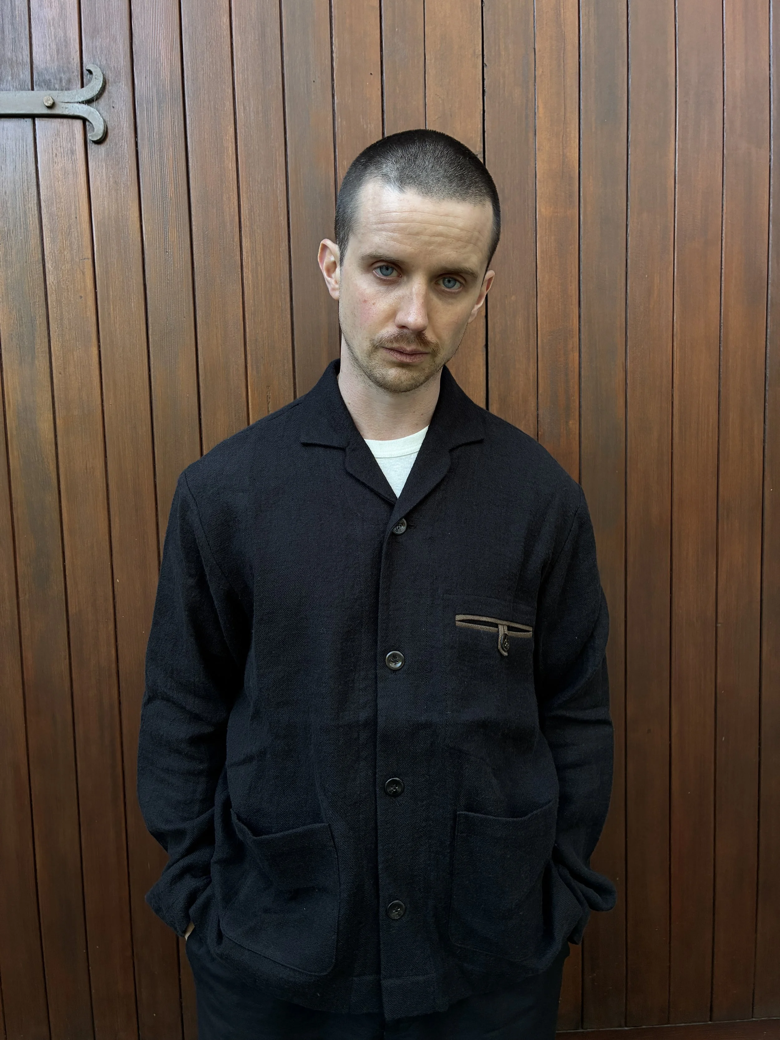 Closeup of man wearing Frank Leder Black Wool Shirt Jacket outside
