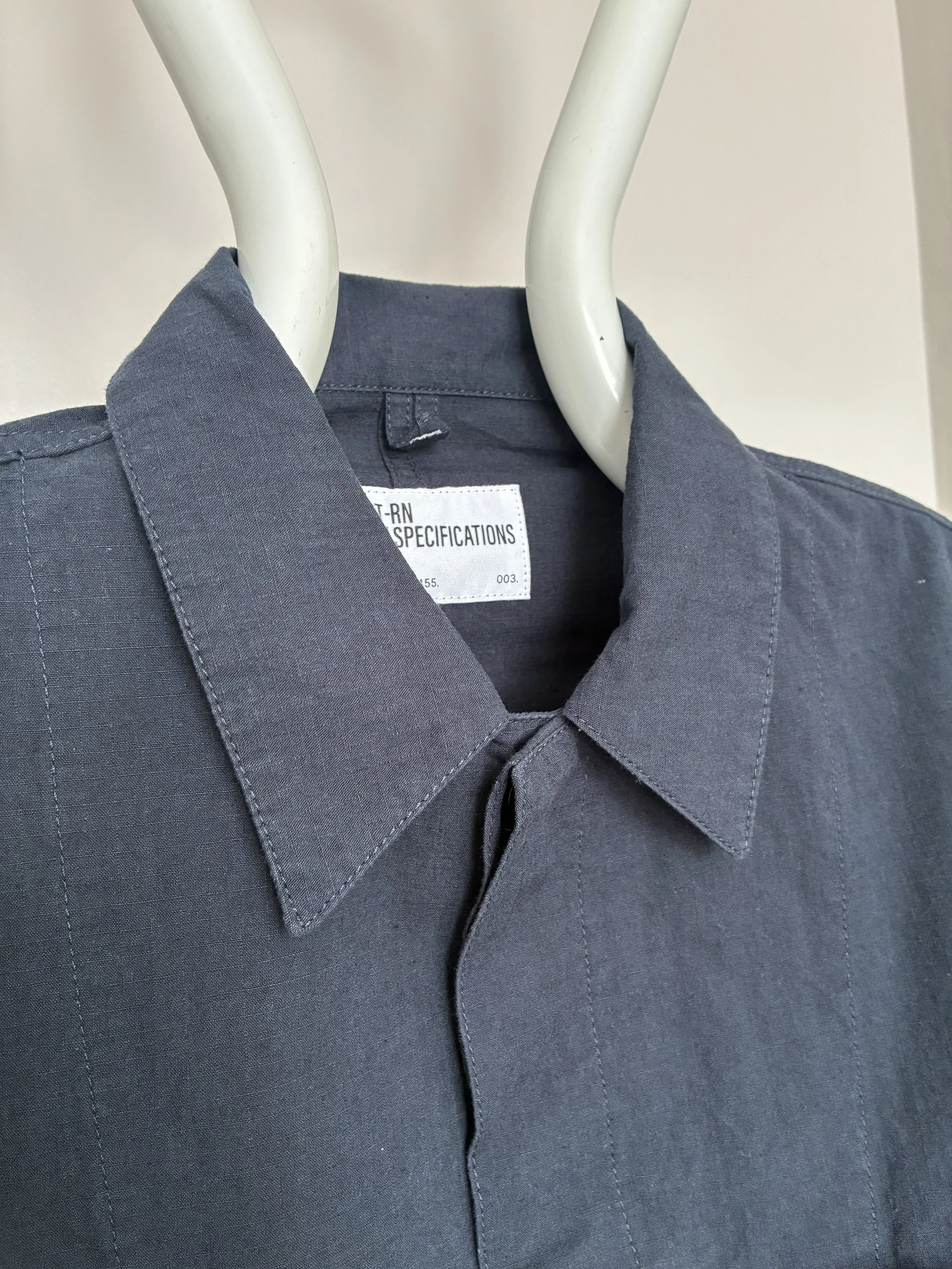 Closeup of collar of 1st PAT-RN Navy Camden Jacket on mannequin