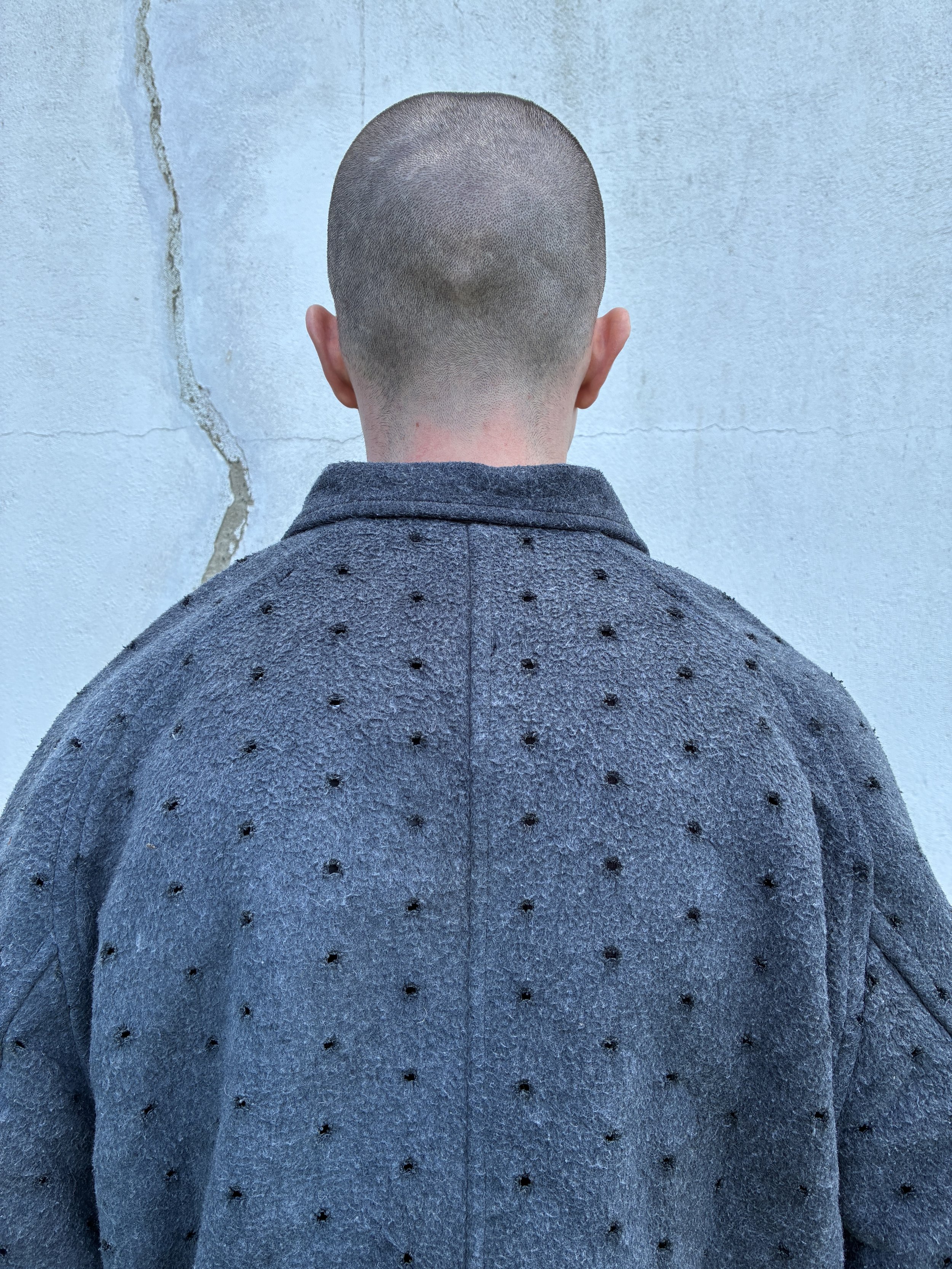 Closeup of man outside wearing Middle Distance grey Drill jacket