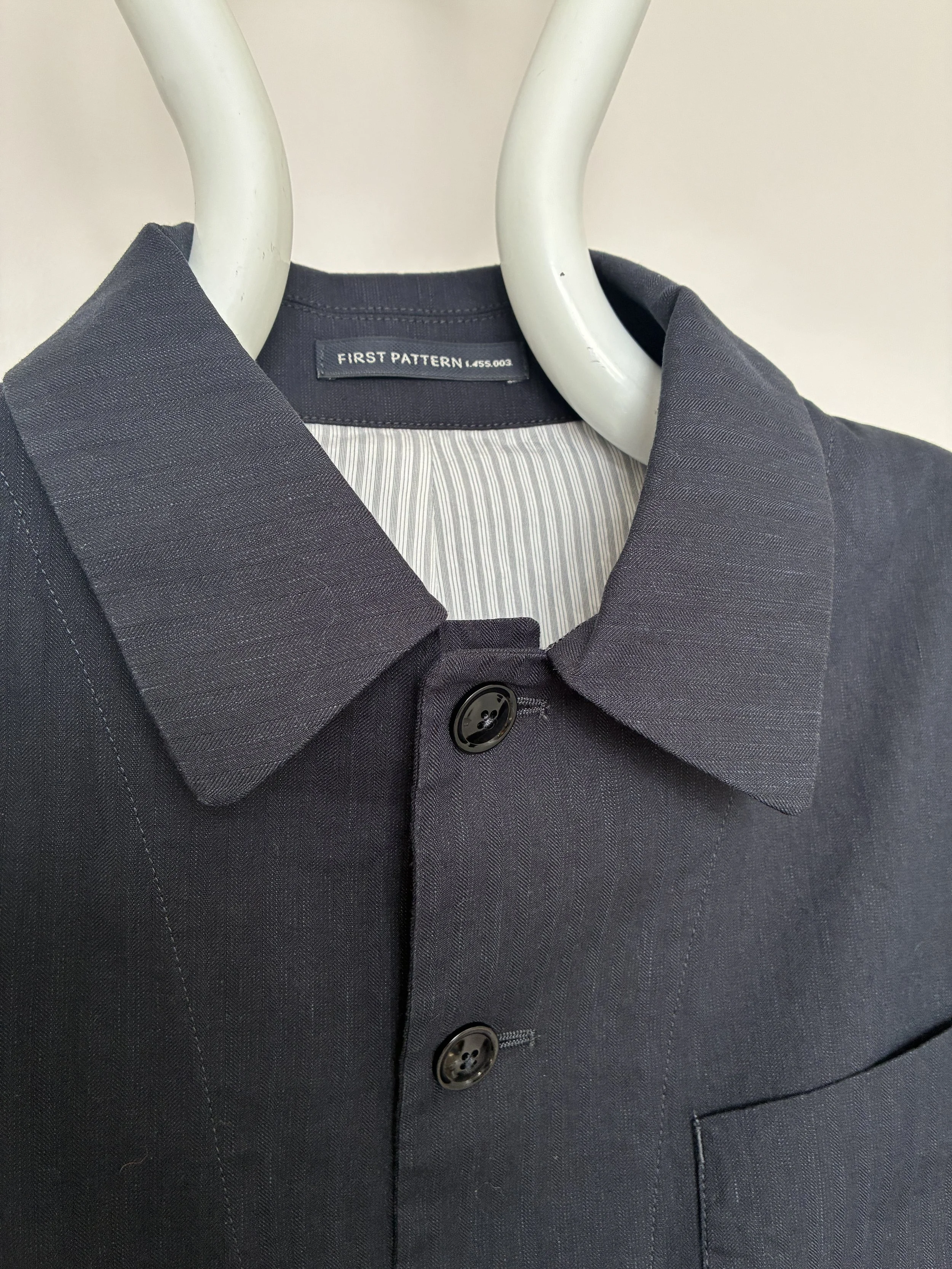 Closeup of collar of Navy 1st PAT-RN Notion Jacket on mannequin