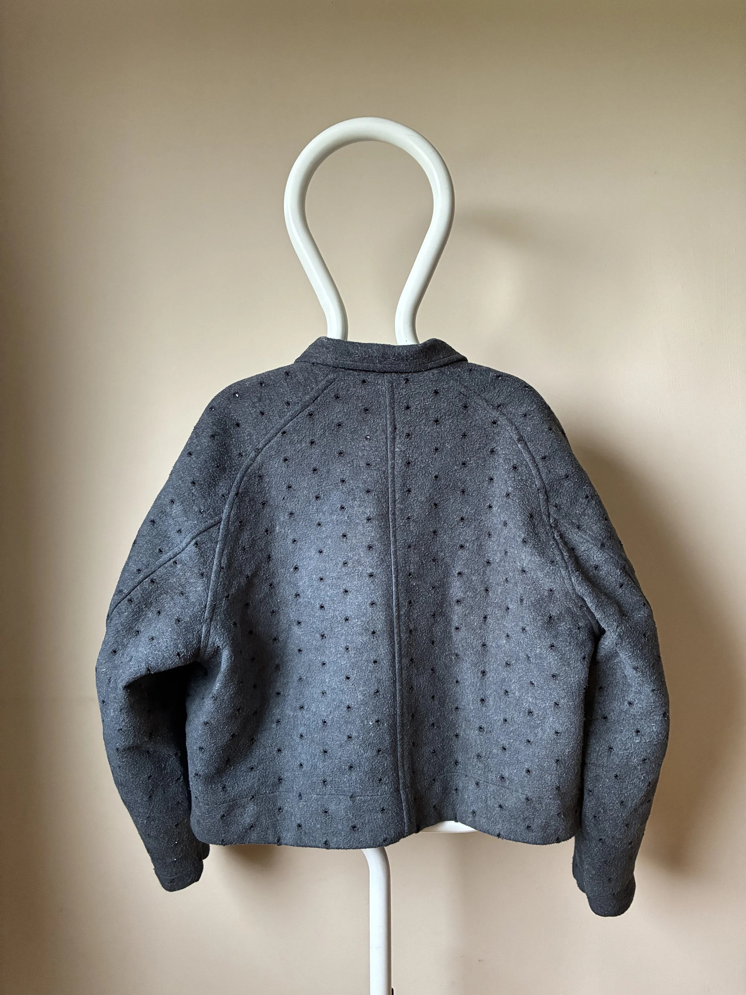 Back of Middle Distance grey Drill jacket on mannequin