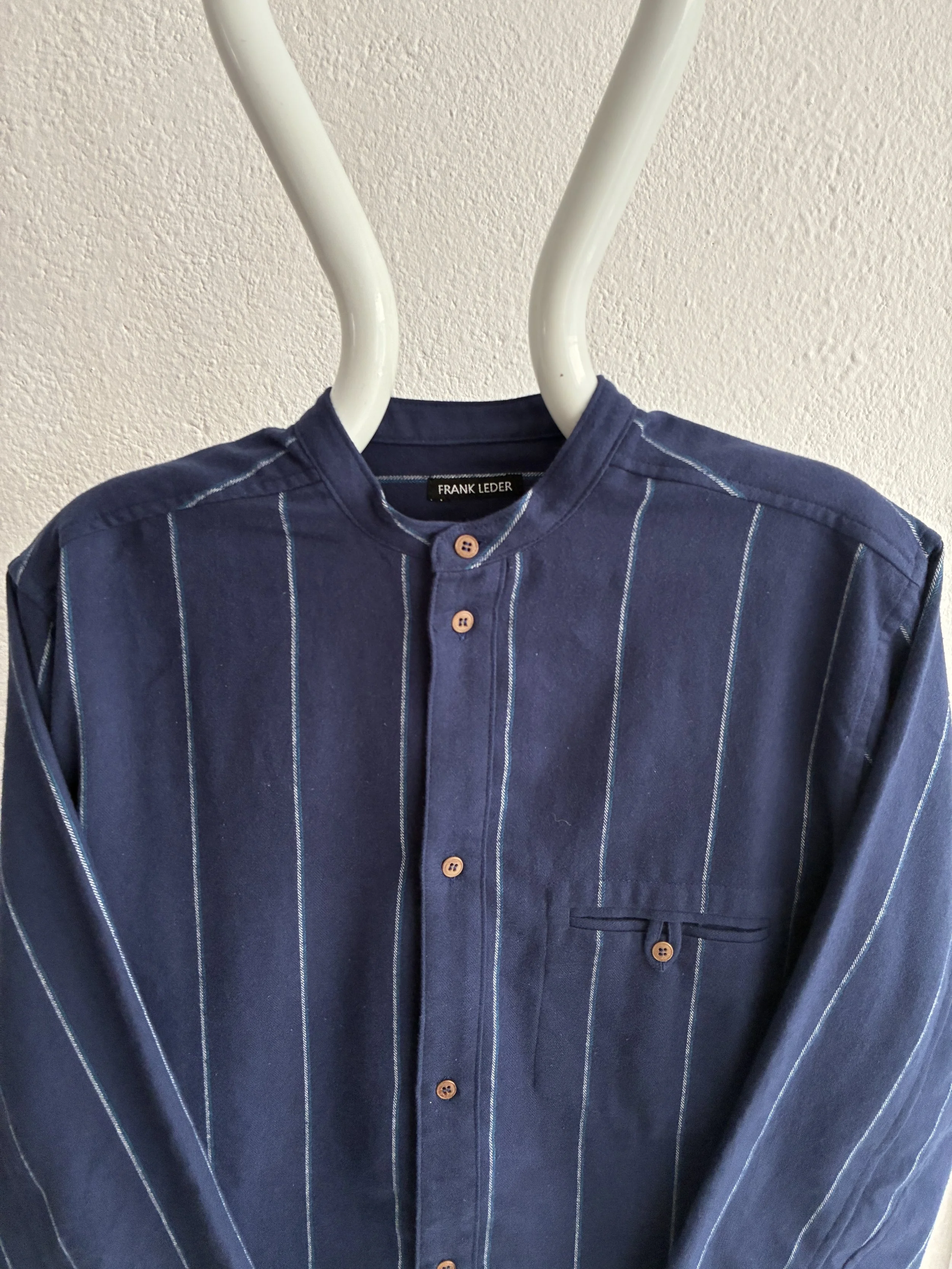 Mannequin wears a Frank Leder navy striped shirt, closeup view