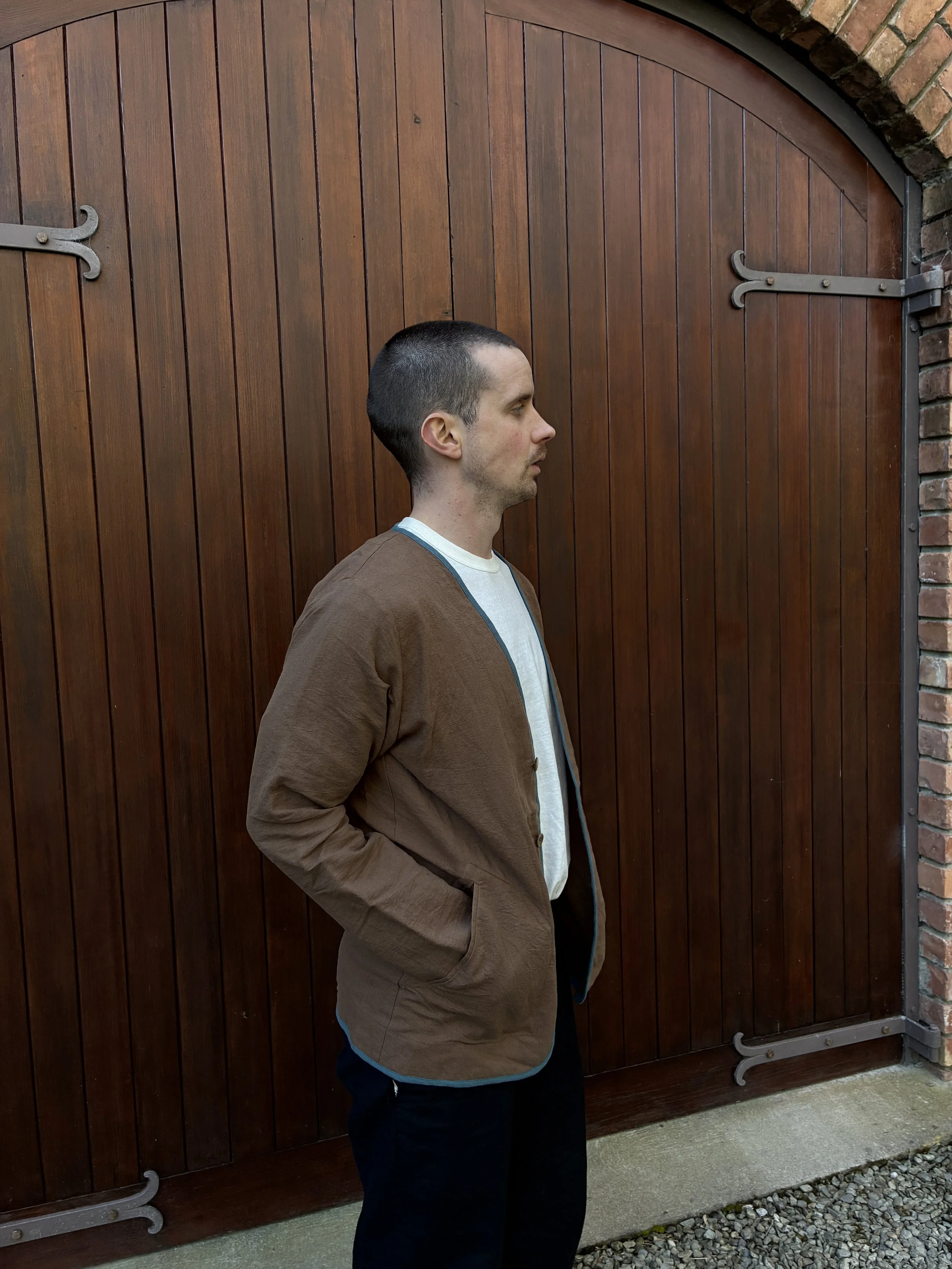 Side profile of man wearing Frank Leder Linen Cotton Brown Teal Jacket outside