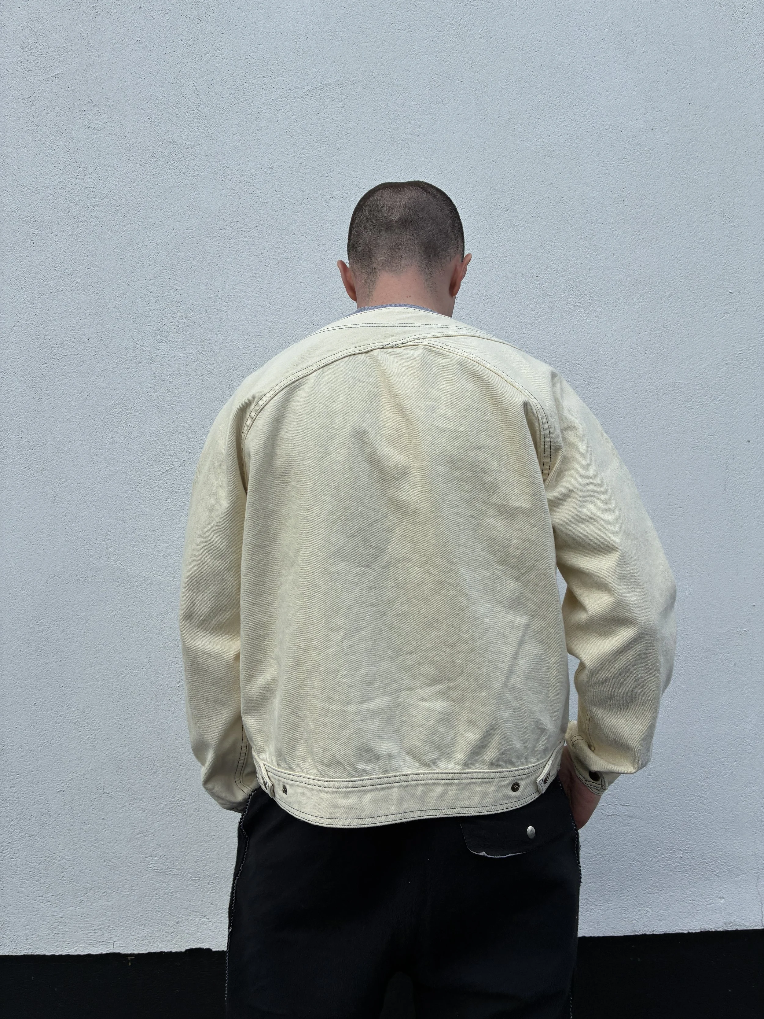 Back of man wearing Working Skewed yeast jacket
