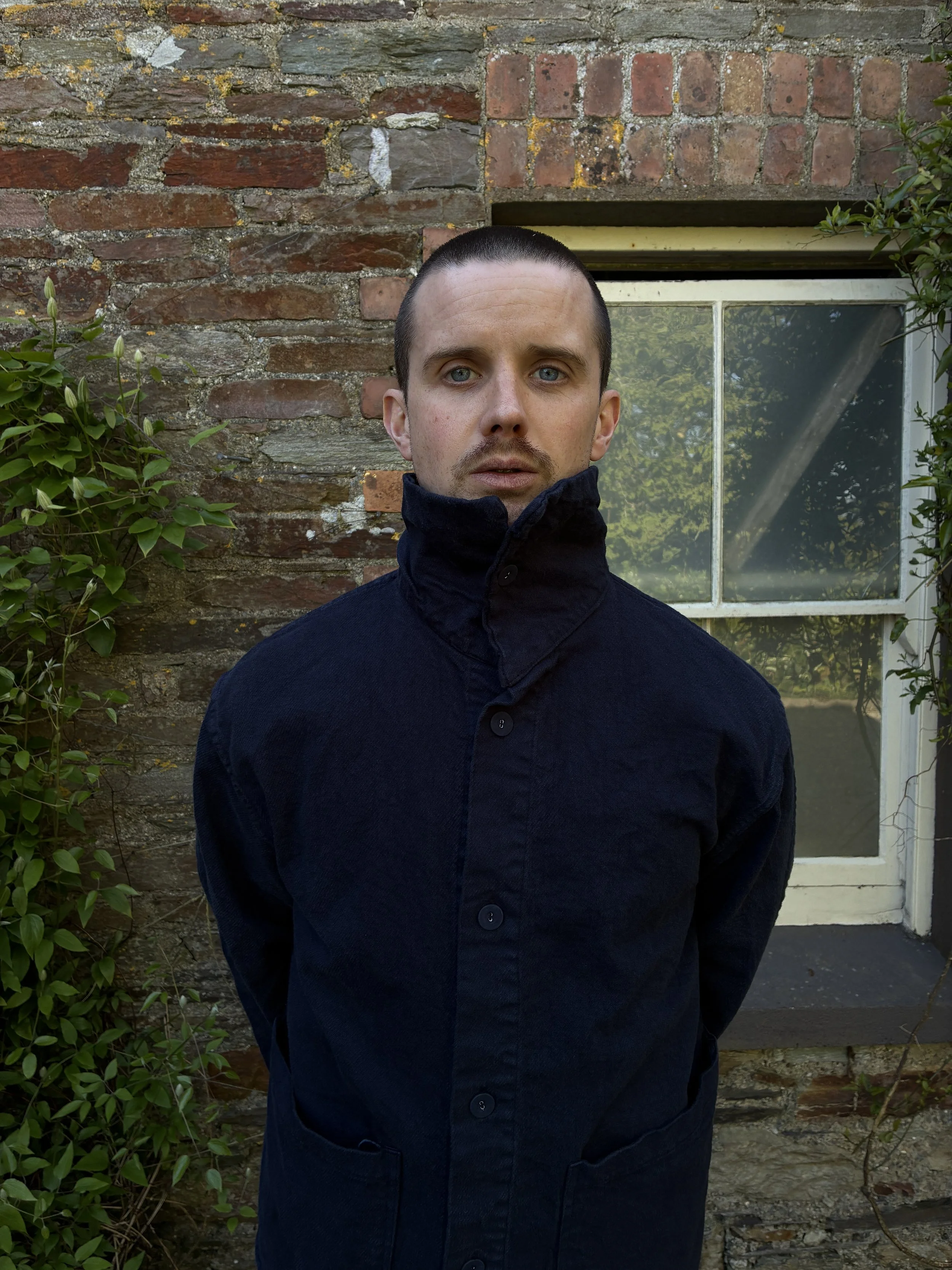 Close up of man in Tender Co 931 Scout Jacket in Hadal Blue