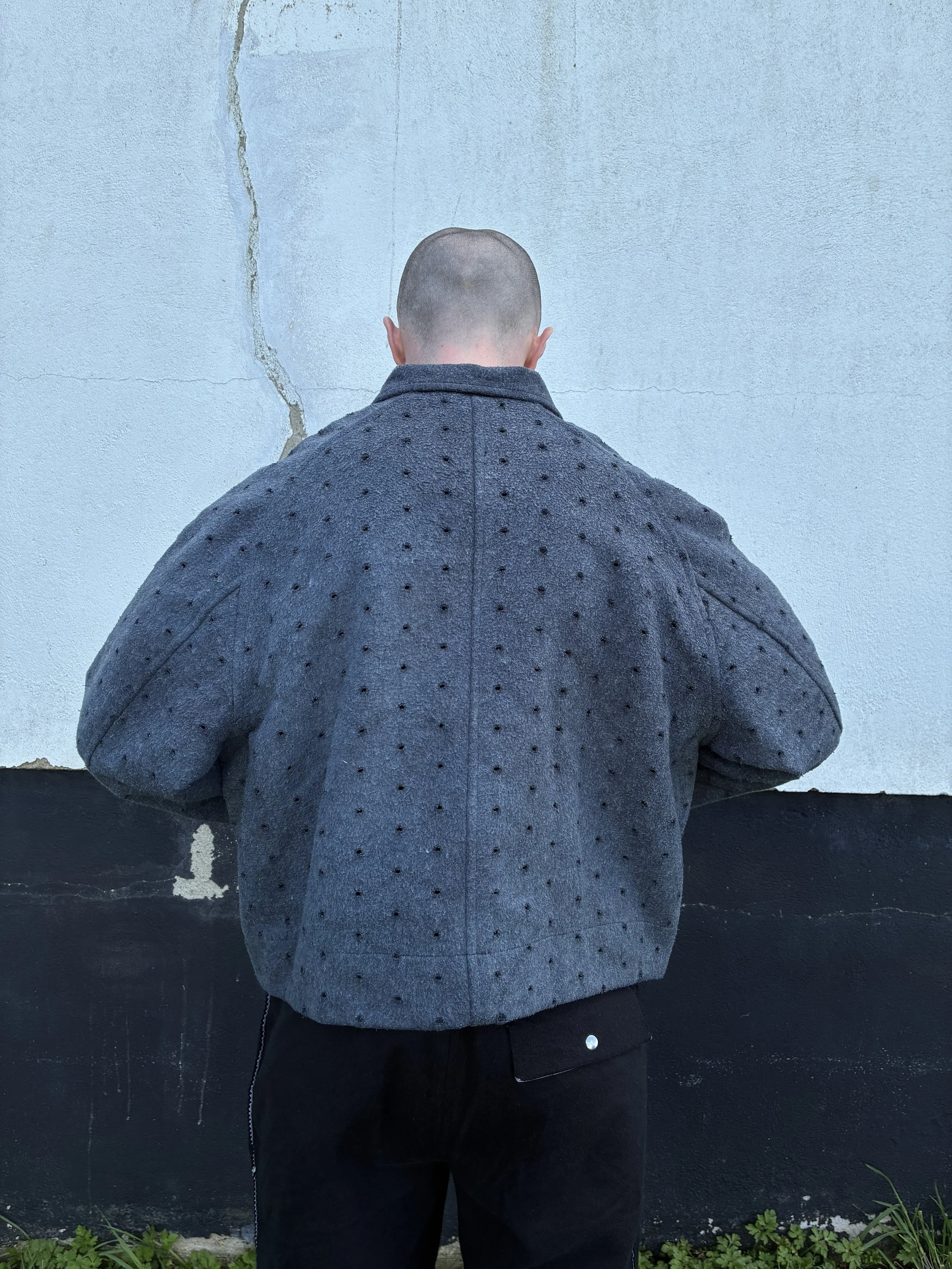 Back of man outside wearing Middle Distance grey Drill jacket