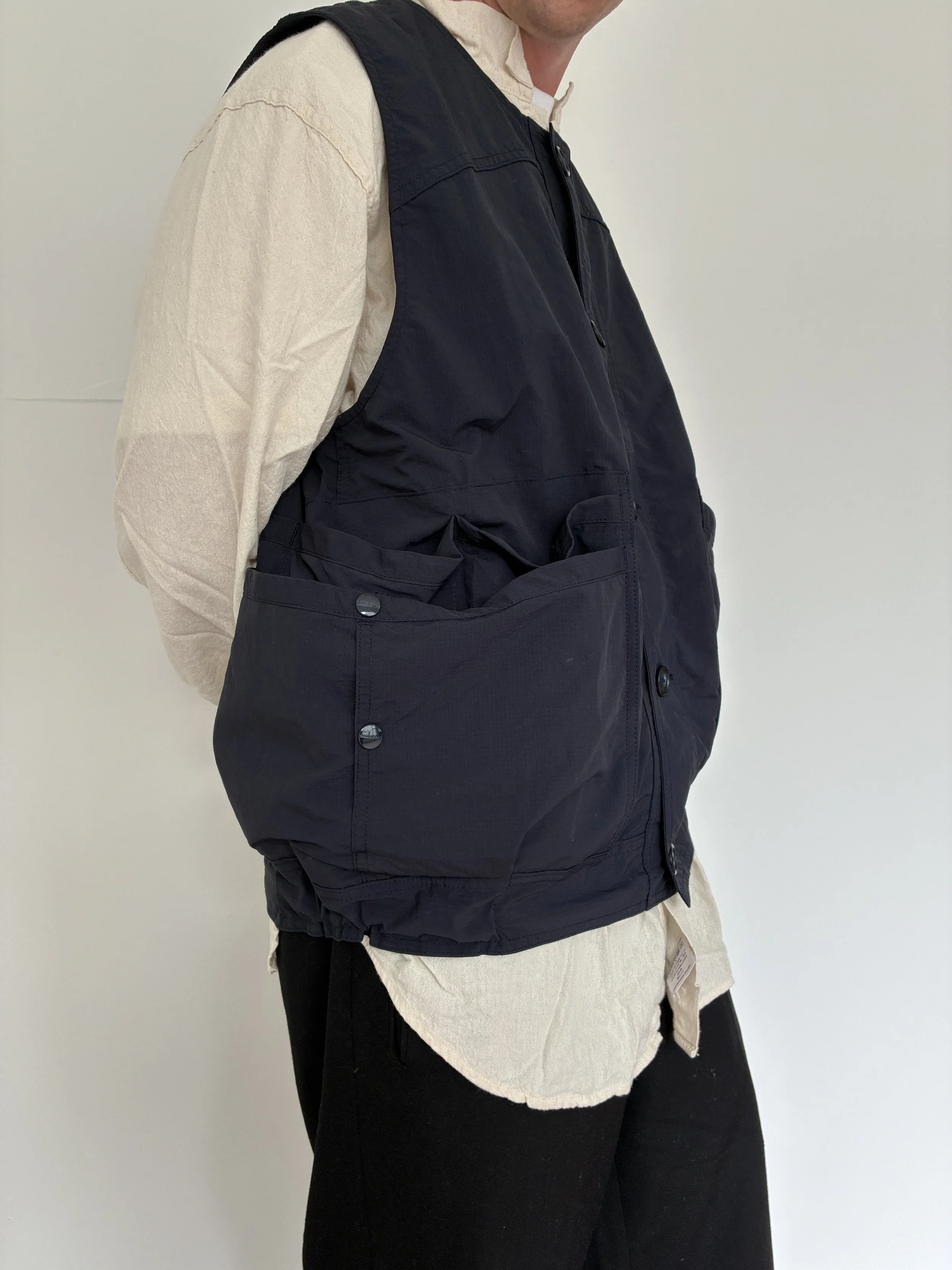 Closeup of person wearing Navy Sassafras Overgrown Hiker Vest