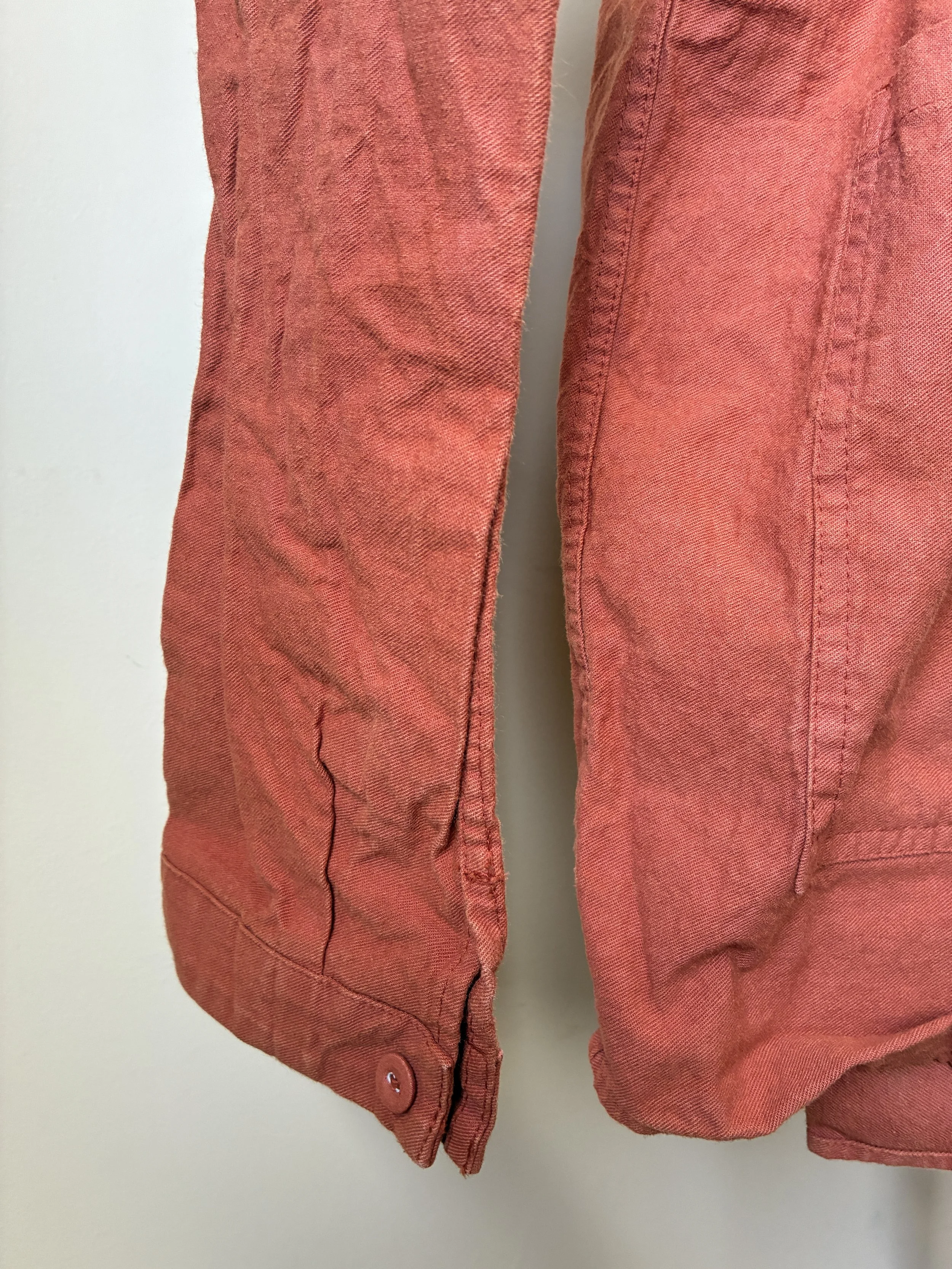 Closeup of Tender Co 402 Two Birds Shirt sleeve cuff in Flowerpot orange