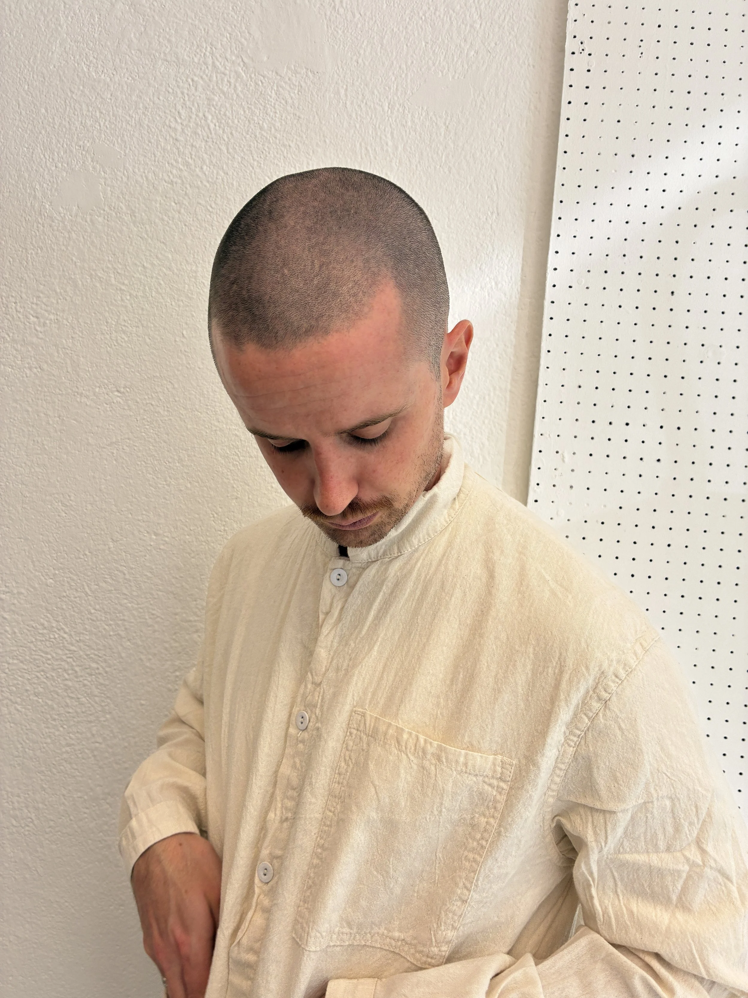 Closeup of man wearing Tender Co Type 457 ecru rinsed Frock Shirt