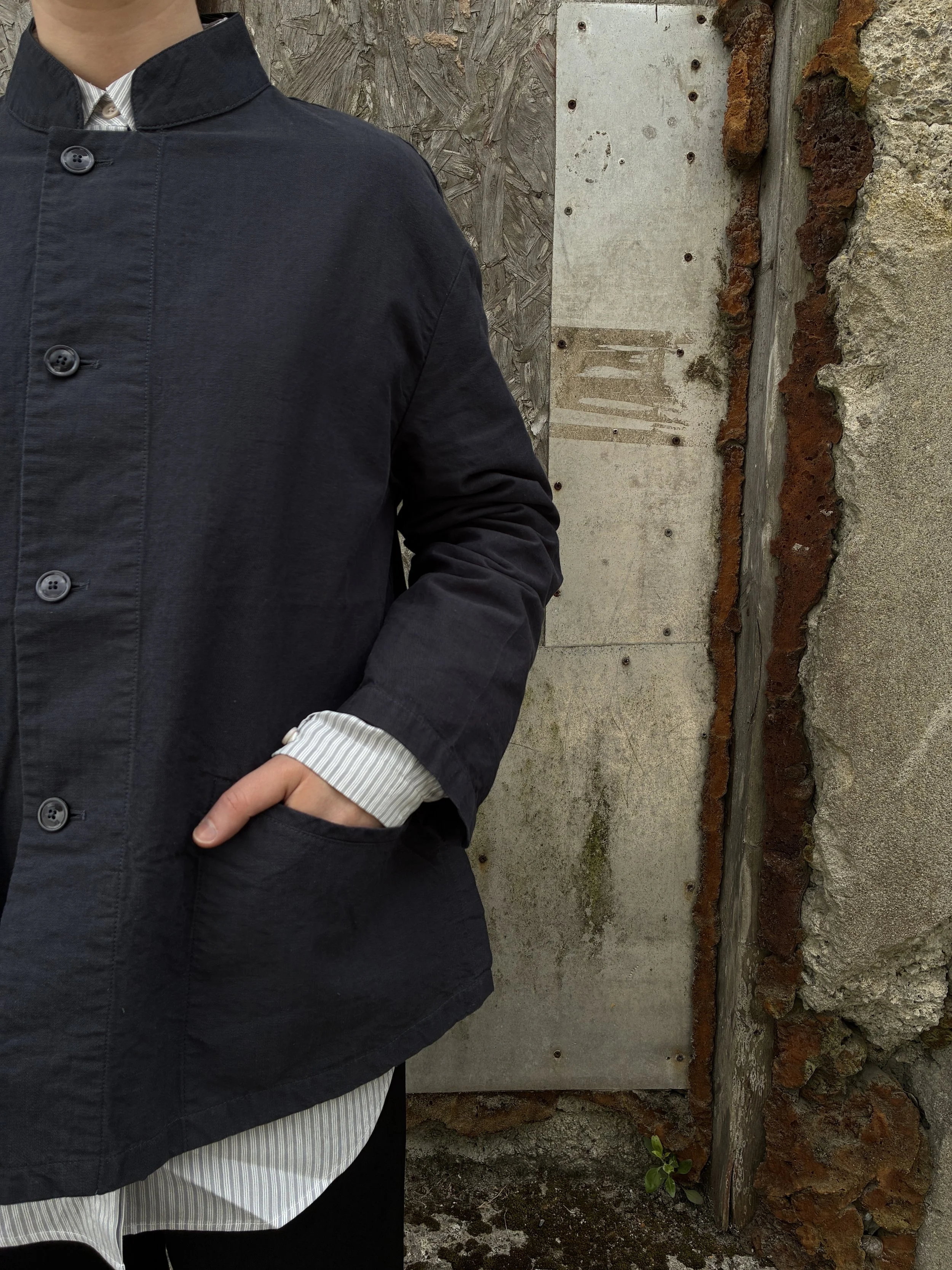 Hand in pocket closeup of Woman wearing Navy 1st PAT-RN Woman Rei Jacket
