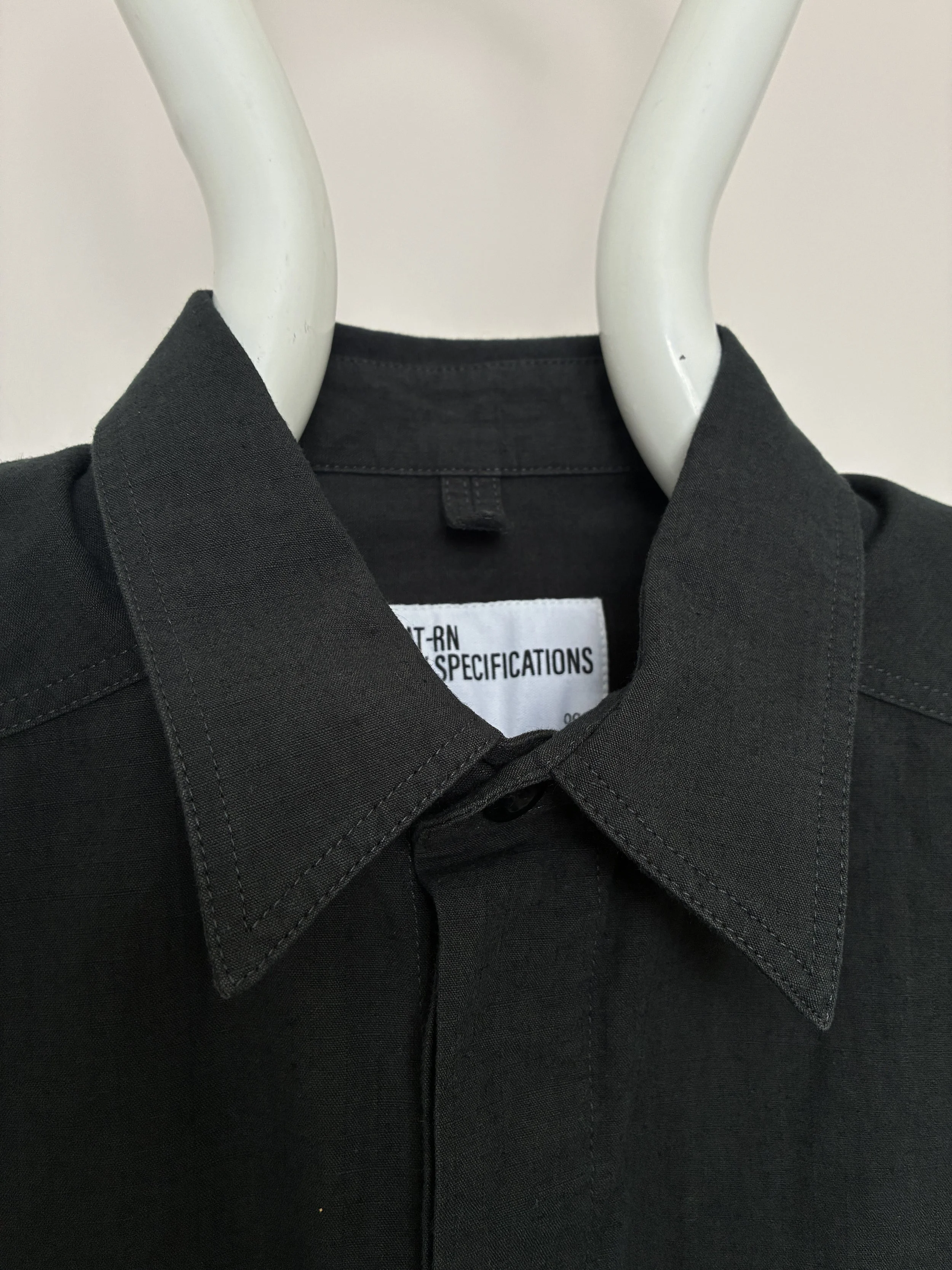 Closeup of collar of 1st PAT-RN Sumatra Charcoal Overshirt on mannequin