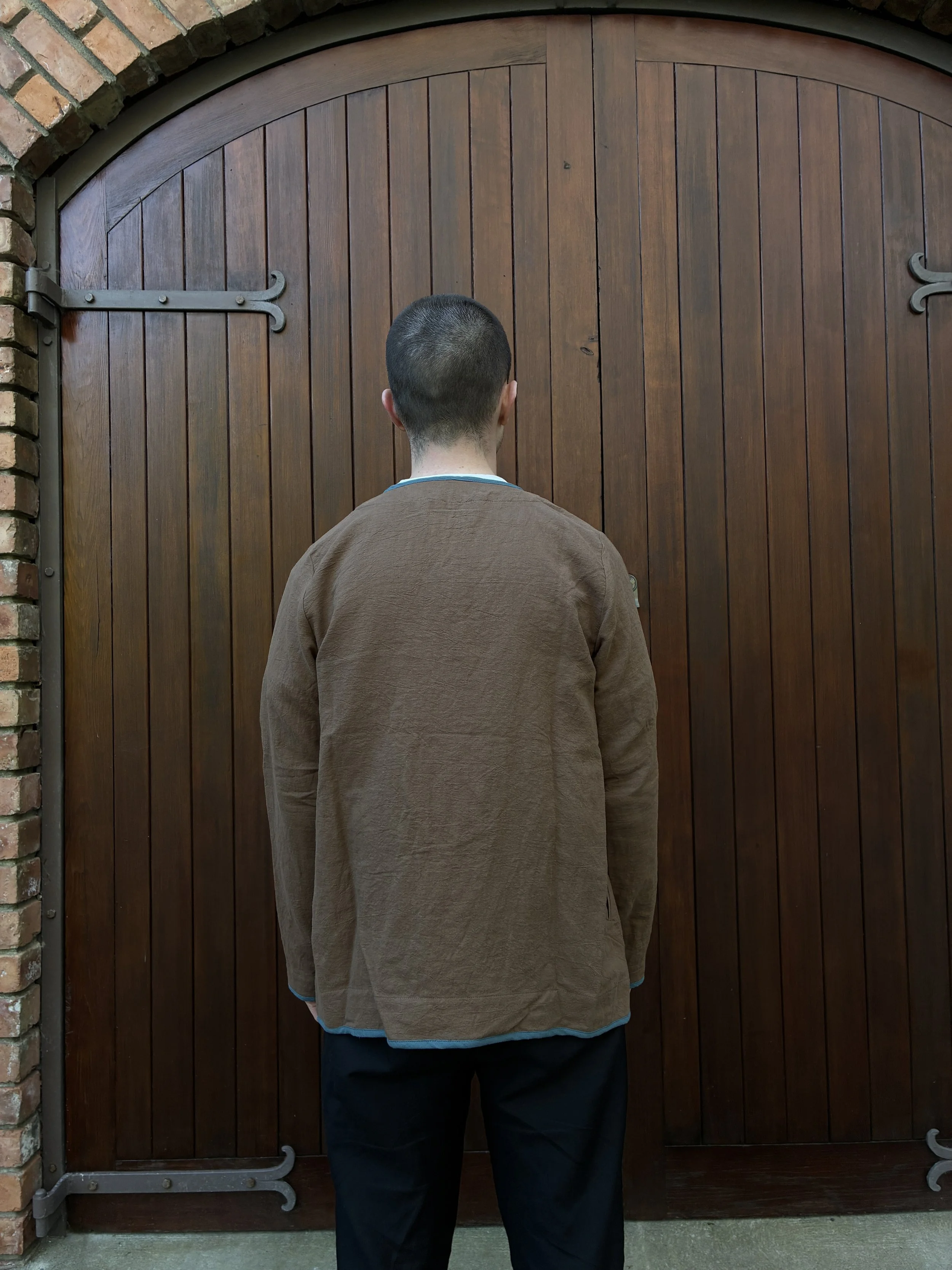 Back of man wearing Frank Leder Linen Cotton Brown Teal Jacket outside