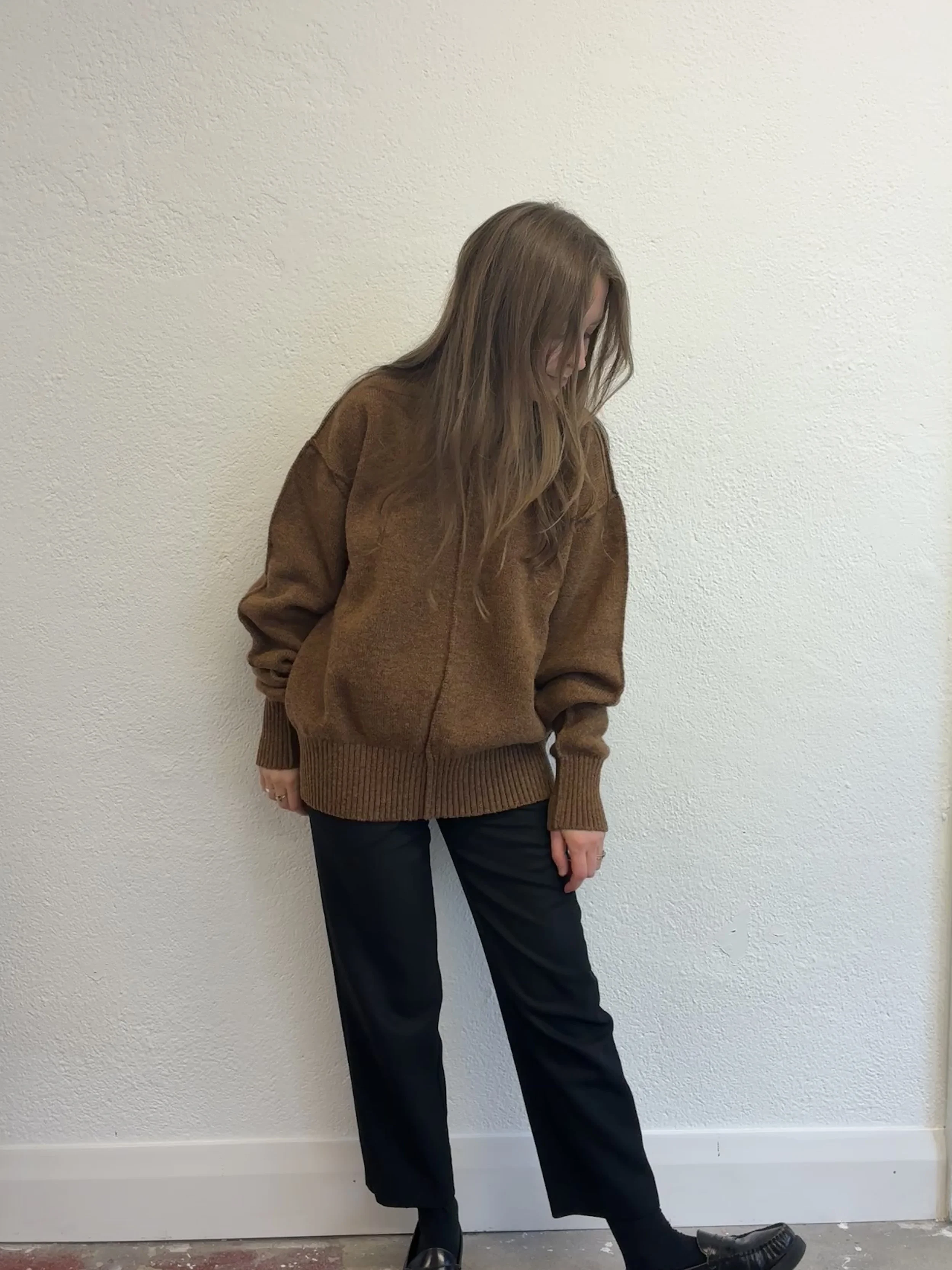 Woman in front of wall wearing Brown Tender Co Type 719 Butterfly Jumper
