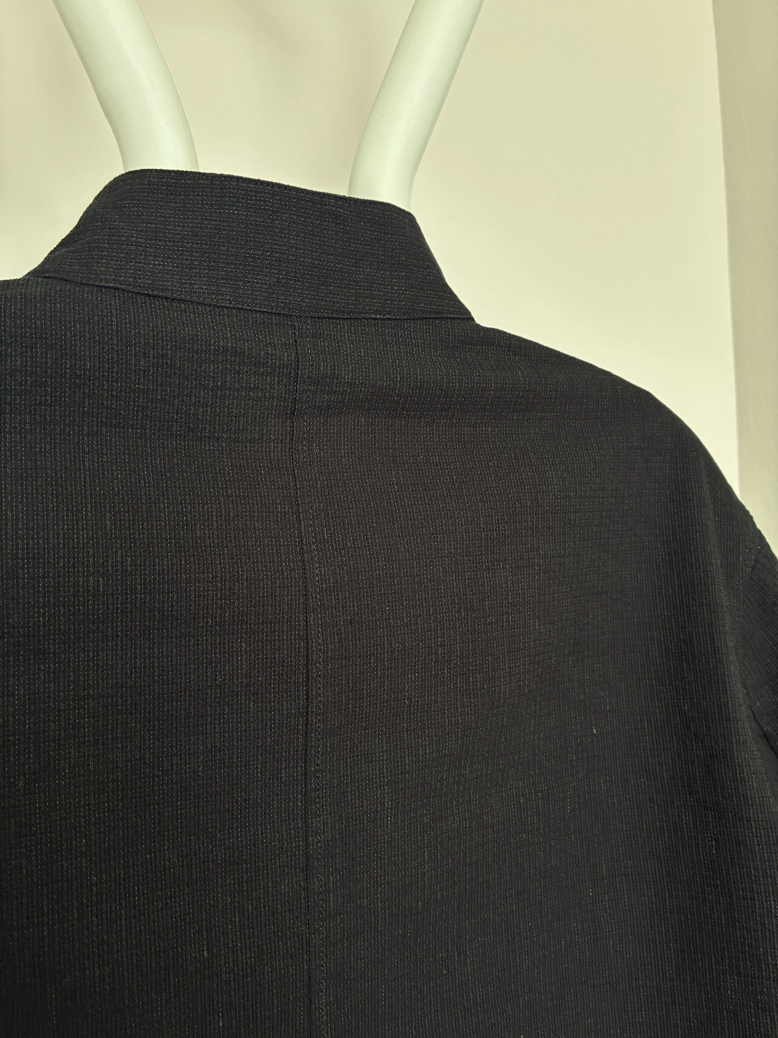 Closeup of back of Charcoal 1st PAT-RN Woman Rei Jacket on mannequin