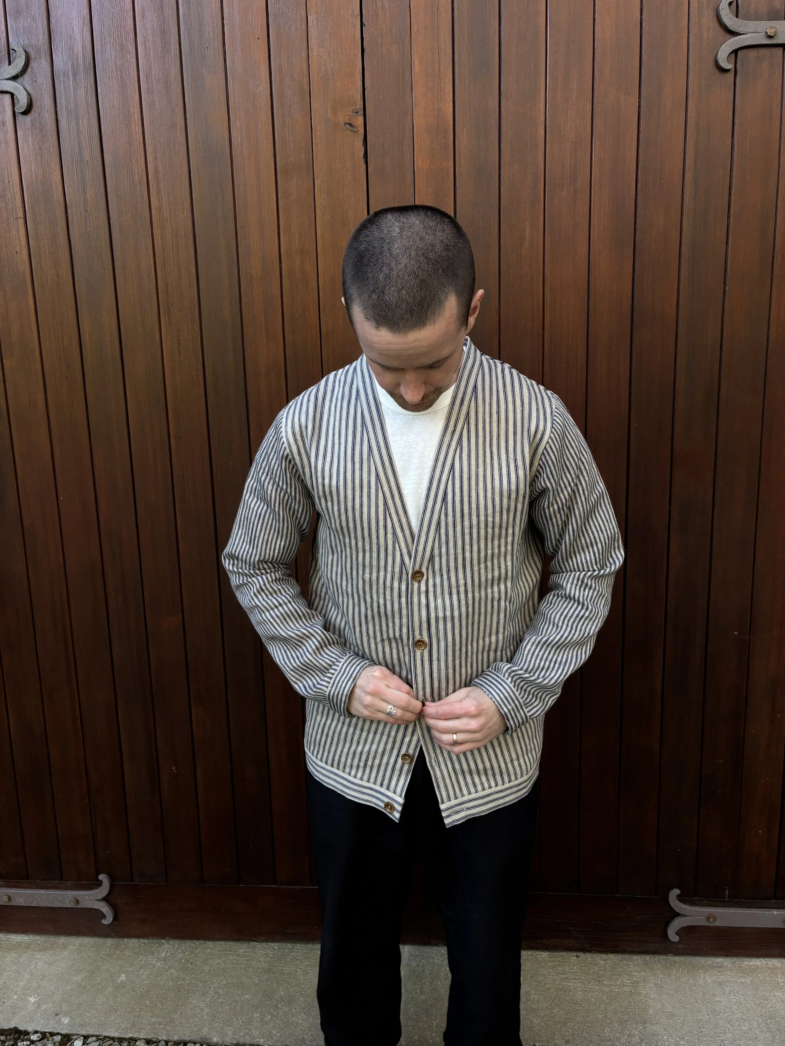Man buttoning up Frank Leder Striped Linen Cardigan Jacket