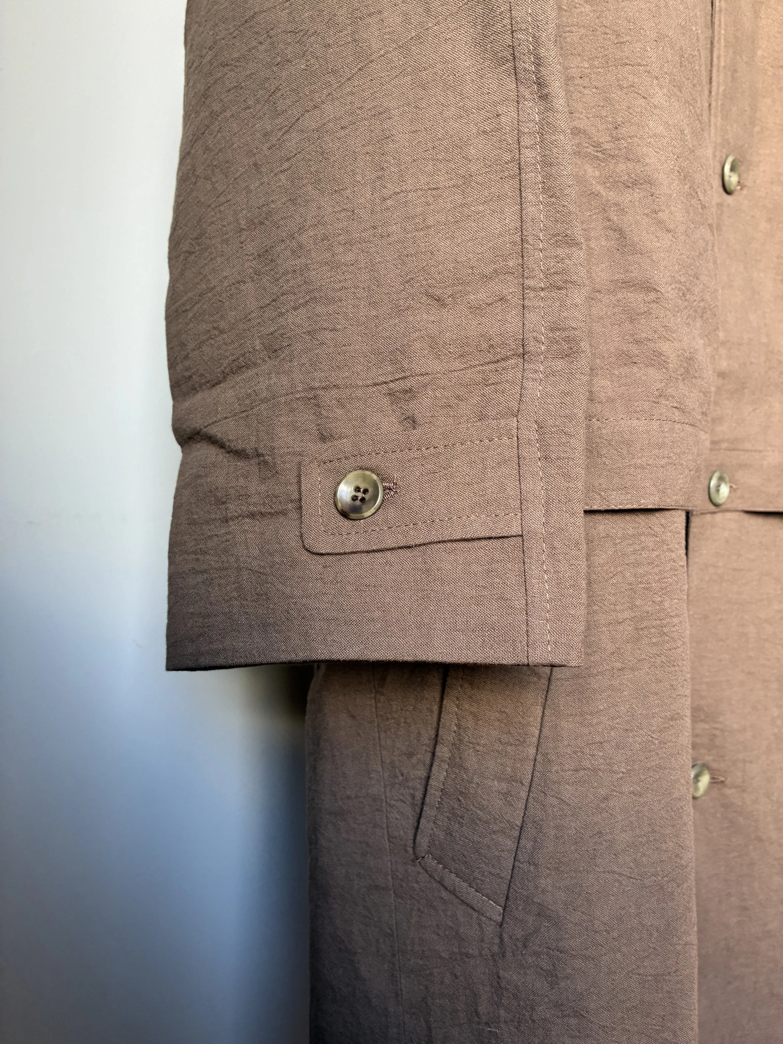 Closeup of cuff of Frank Leder Reversible Coat in Brown