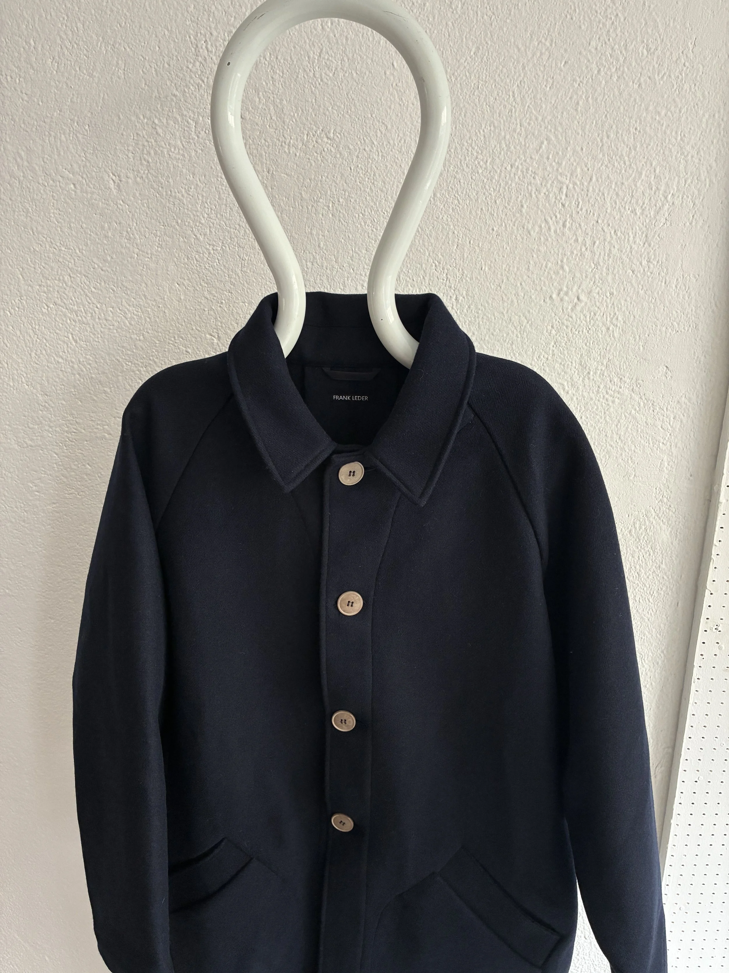 Mannequin wears Frank Leder Navy Wool Duster Coat