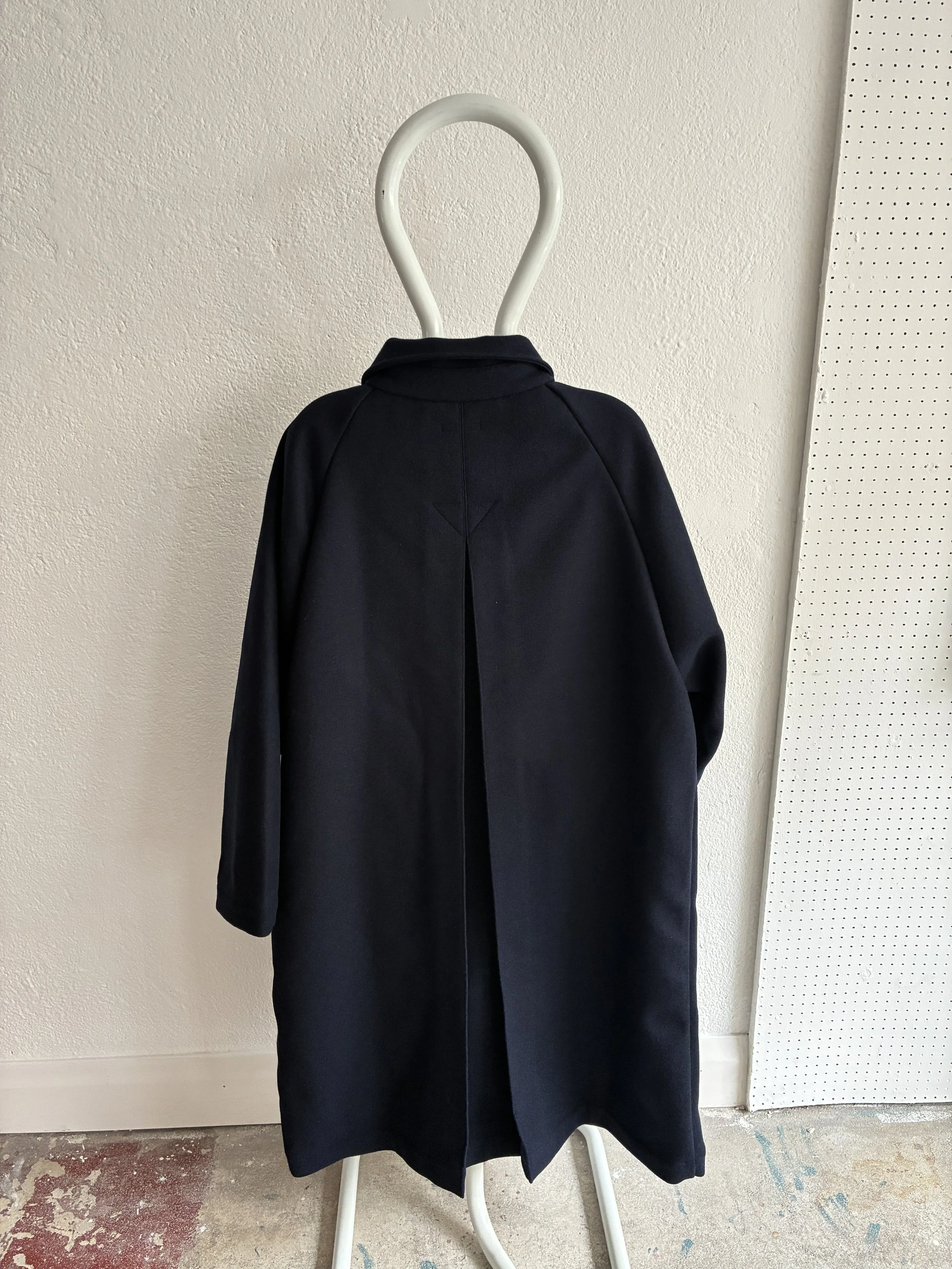Mannequin wears Frank Leder Navy Wool Duster Coat, back view