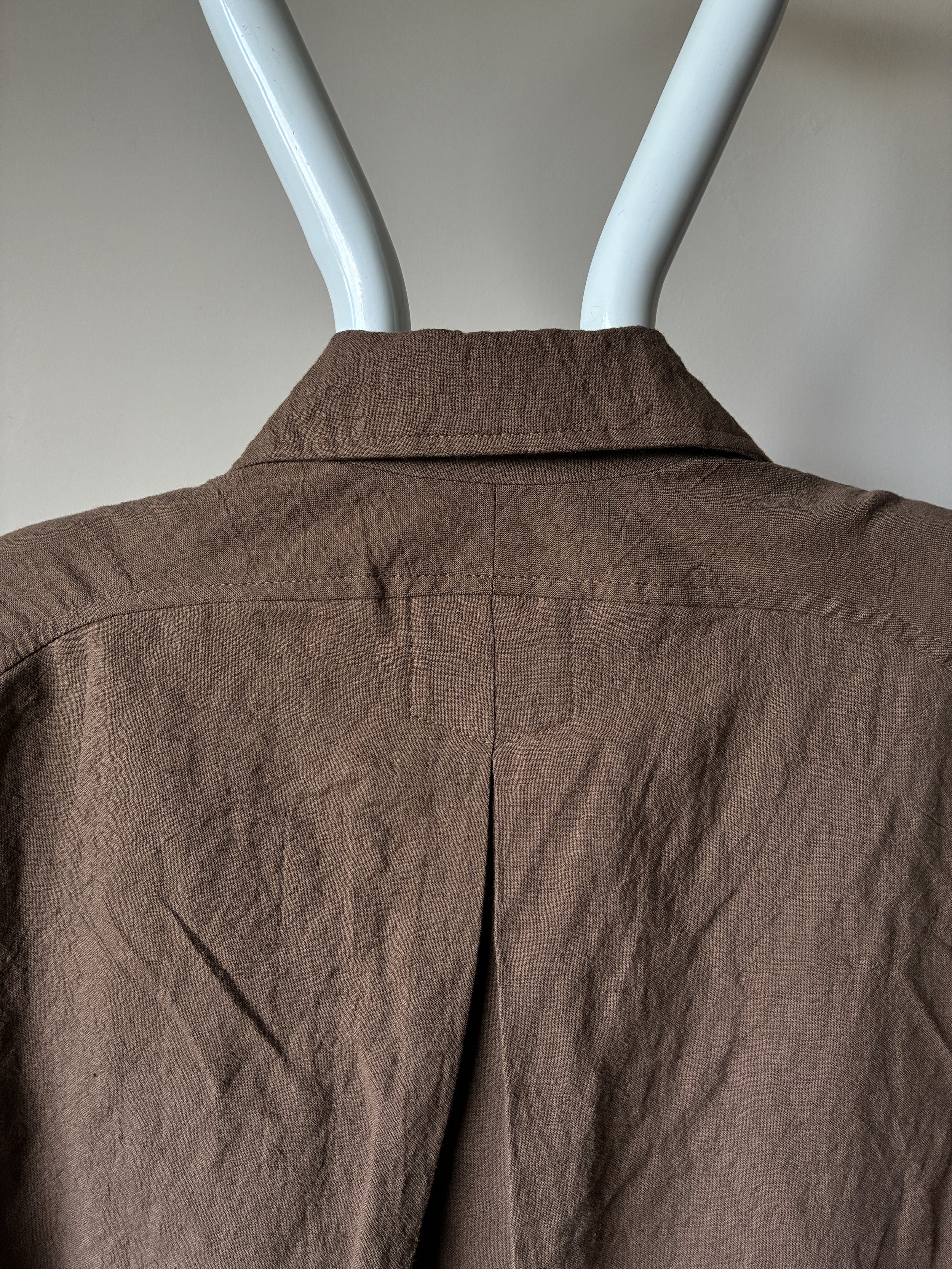 Close up of back of Frank Leder Reversible Coat in Brown and Teal on mannequin