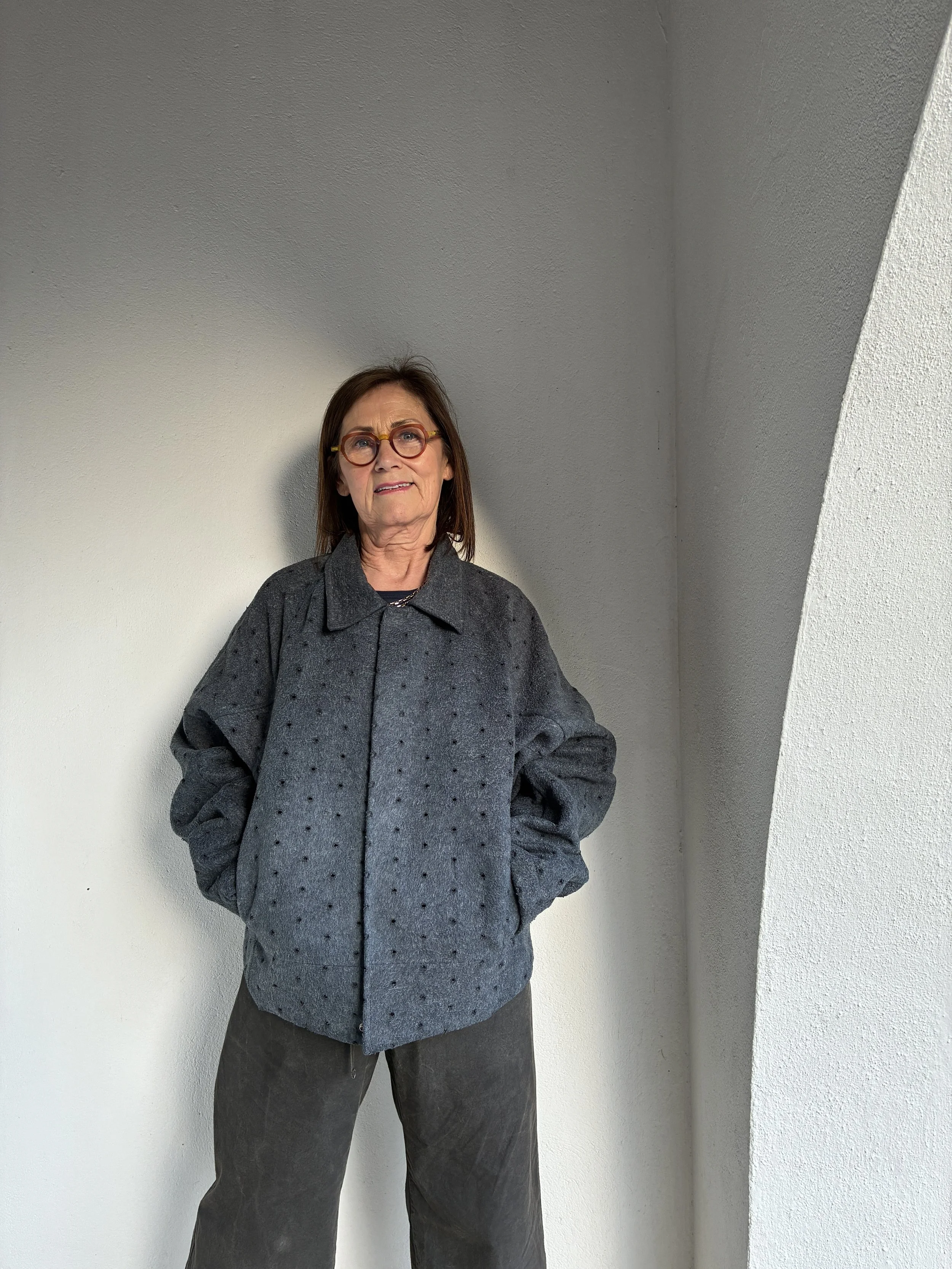 Woman outside wearing Middle Distance grey Drill jacket