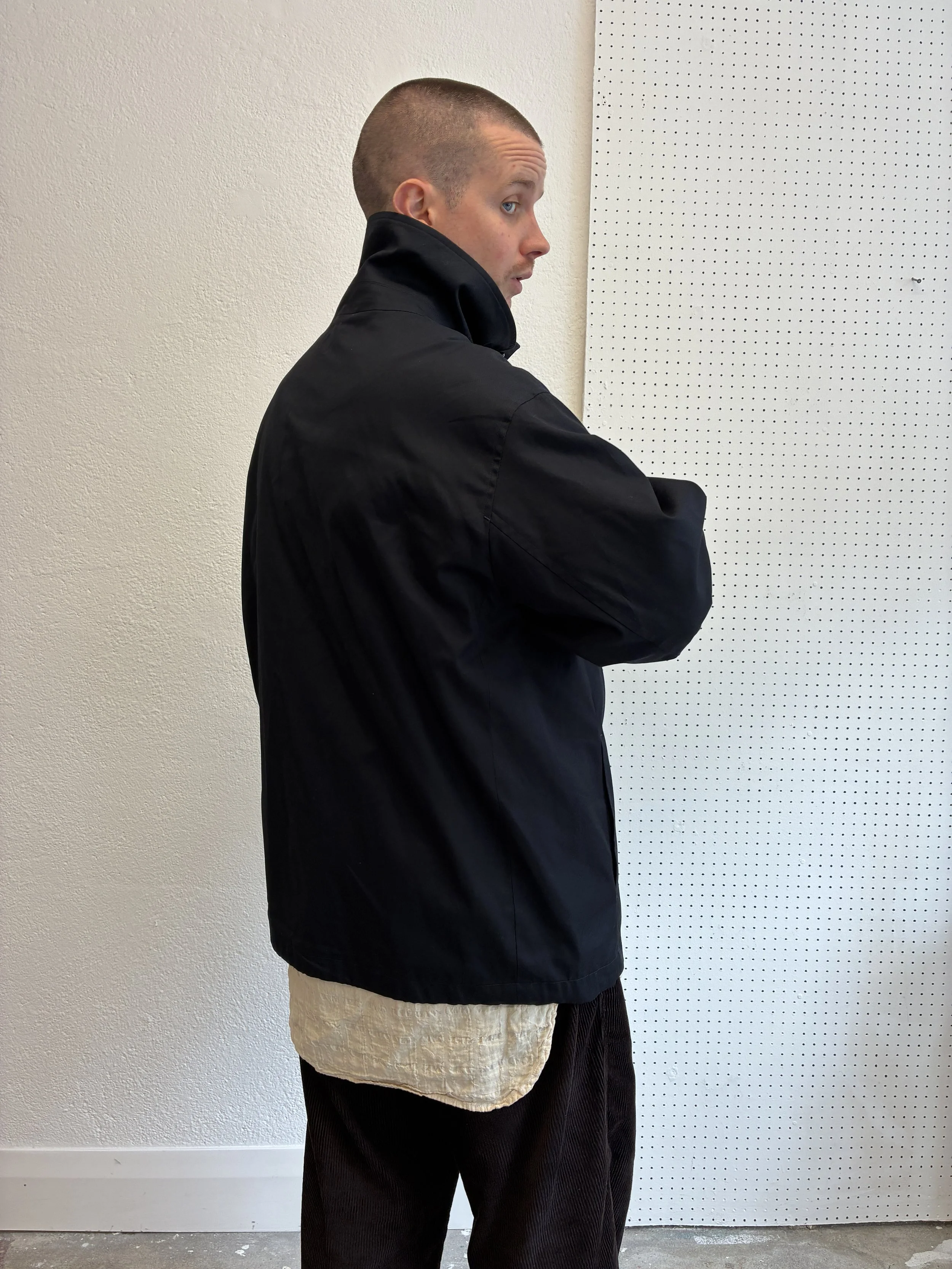 Back of Man wearing Navy De Dam Foundation Cotton Gabardine Jacket
