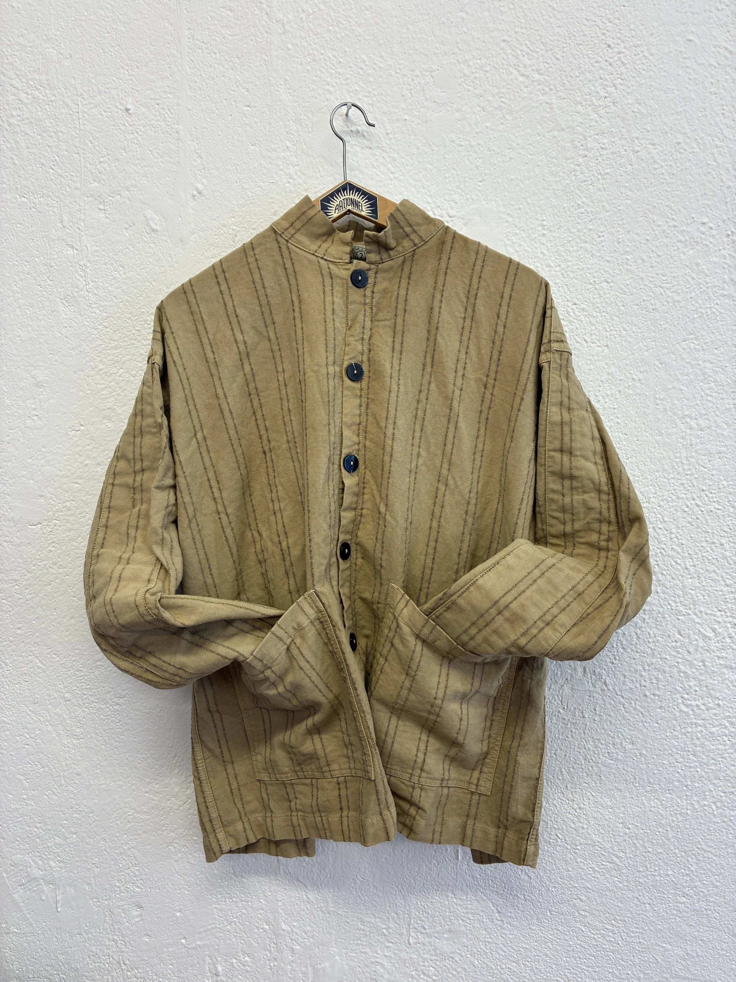 Drab Weld Tender Co Type 485 Isosceles Shirt on hanger with cuffs in pockets
