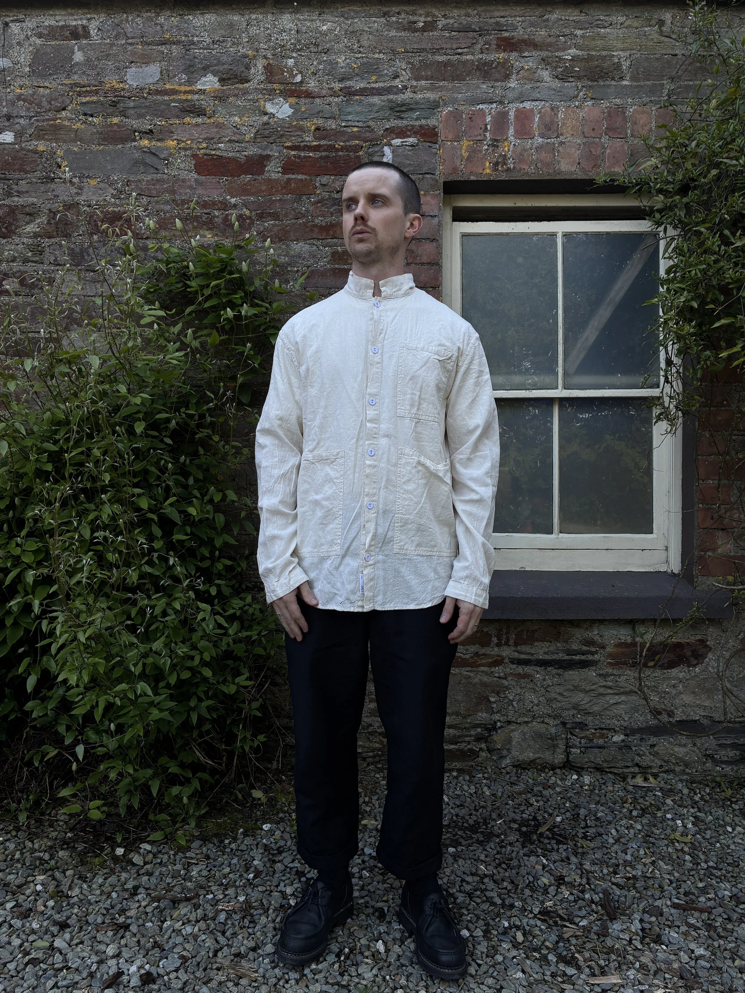 Man wearing cream Tender Co Type 457 Frock Shirt
