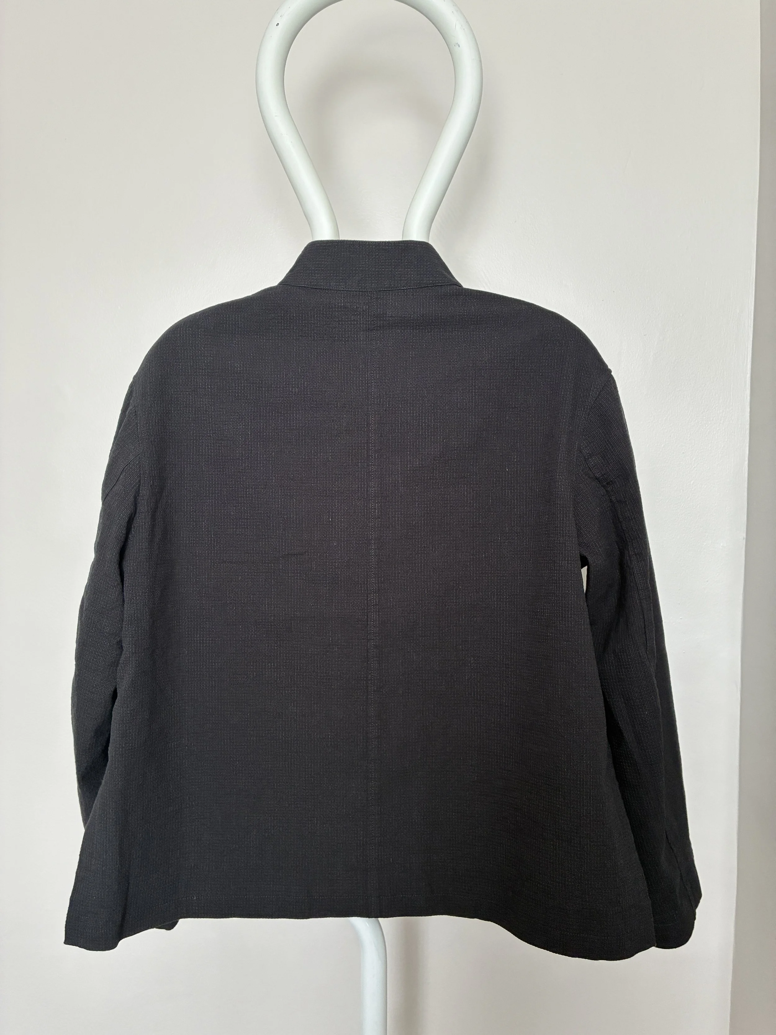 Back of Charcoal 1st PAT-RN Woman Rei Jacket on mannequin