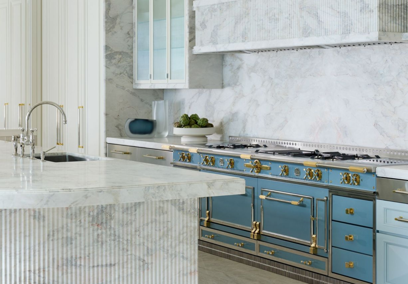 Luxury East Bay kitchen design featuring a La Cornue blue range with brass accents, marble countertops, and fluted marble island by interior designer Liz Crivello of Collected Interiors, Walnut Creek, California.