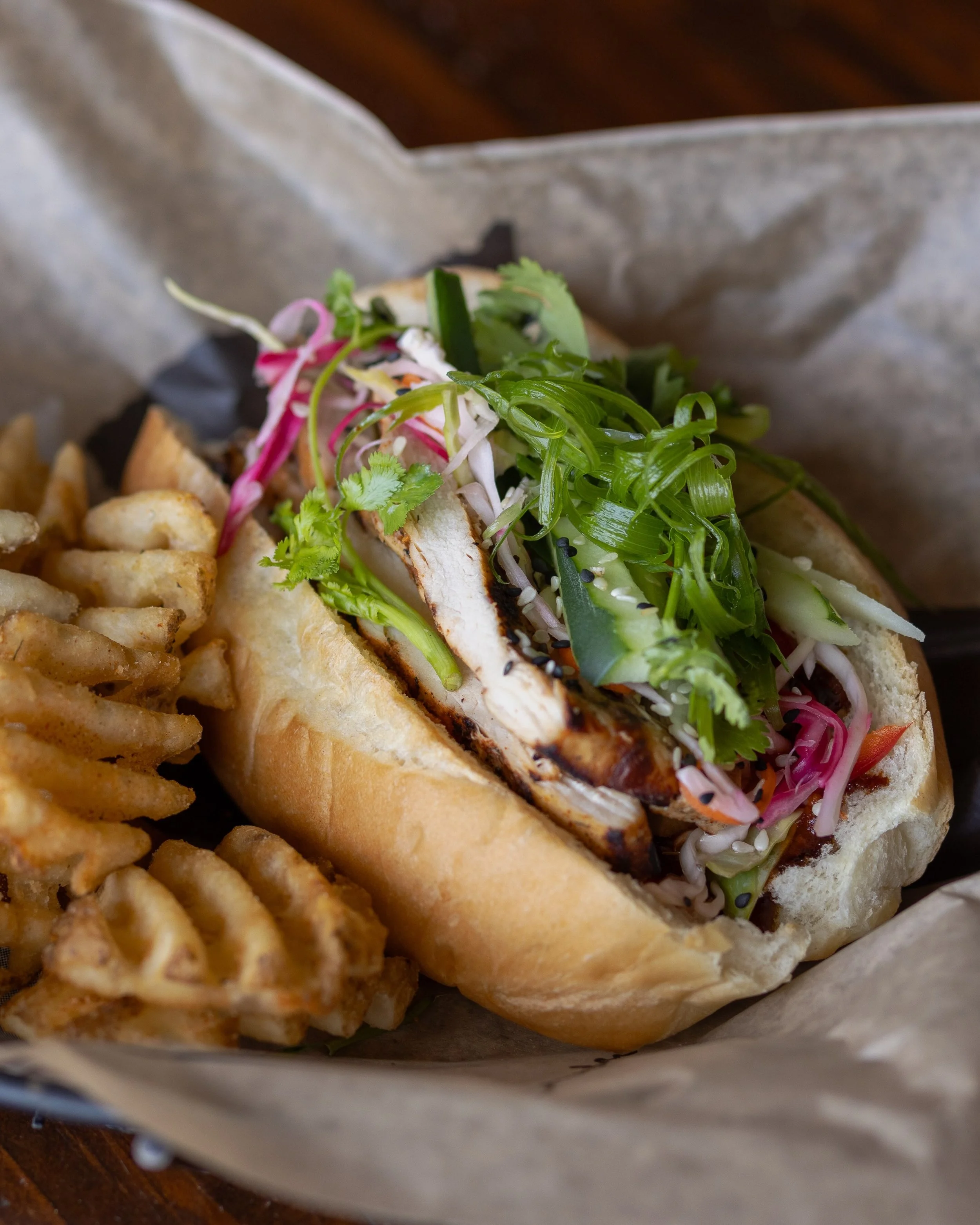 Our new Chef Special is now available! Come try Chef Demarkio&rsquo;s fresh Chicken Bahn Mi made with beer-brined chicken and served on a toasted bun with spicy soy sriracha aioli, tangy pickled cabbage, fresno peppers, cucumbers, cilantro and scalli