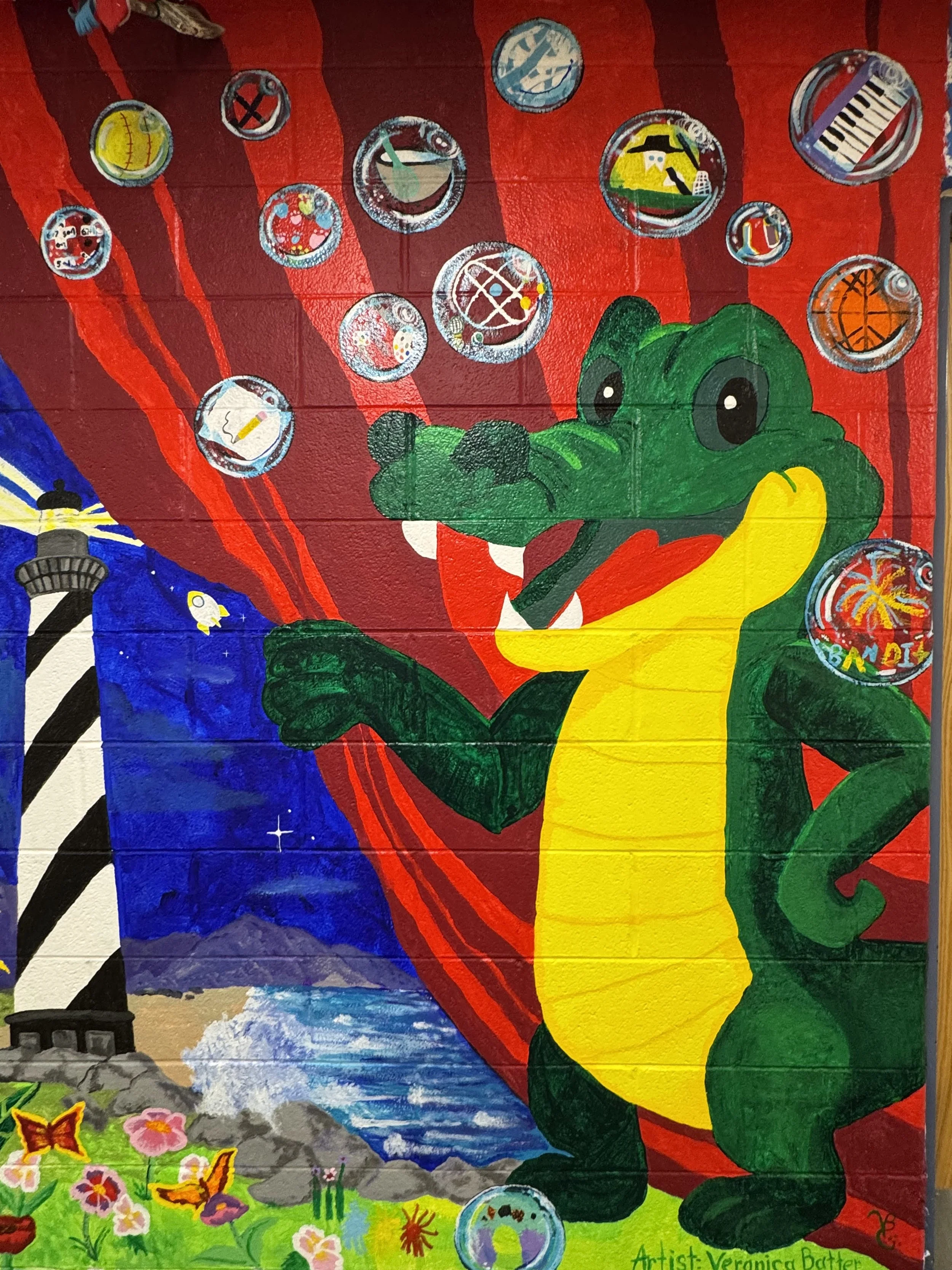 School mascot, the Aston Alligator, pulling the curtain back like Charles Wilson Peale does in his painting "The Artist in his Museum" 1822