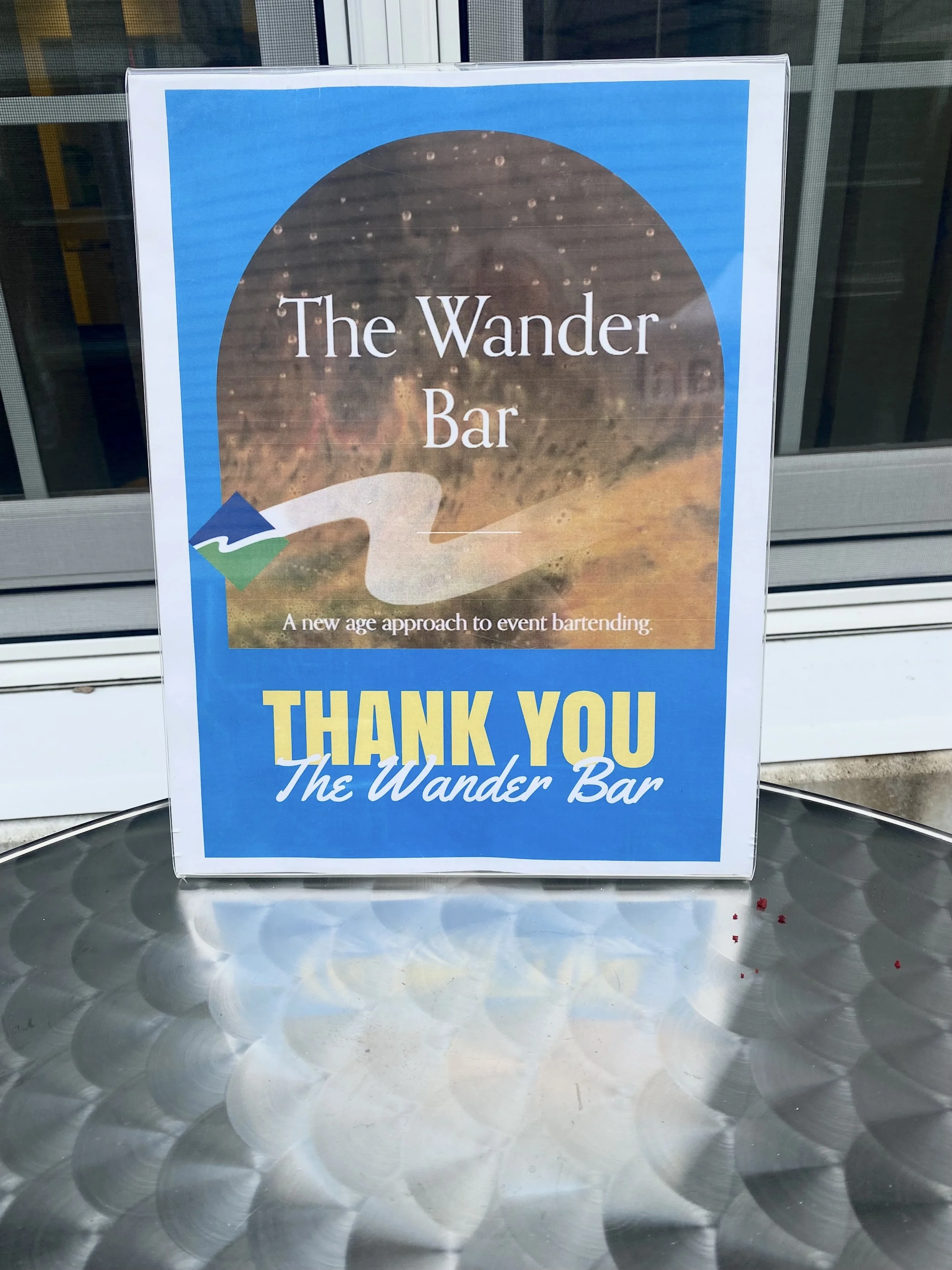 Sign that says 'Thank you The Wander Bar' at company party in Salem NH