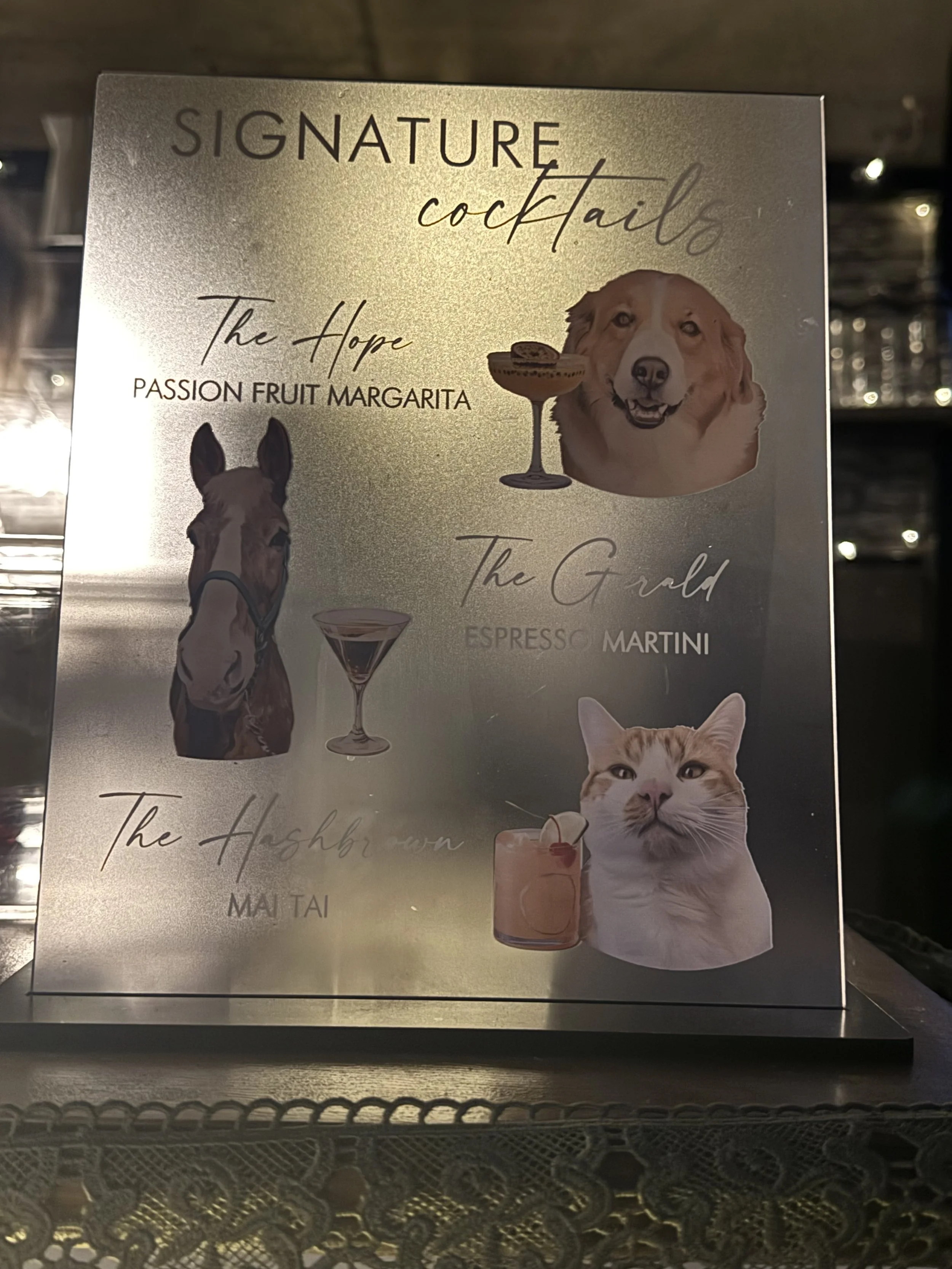 Signature Cocktails Menu with couple's pets displayed at wedding bar service in Keene New Hampshire