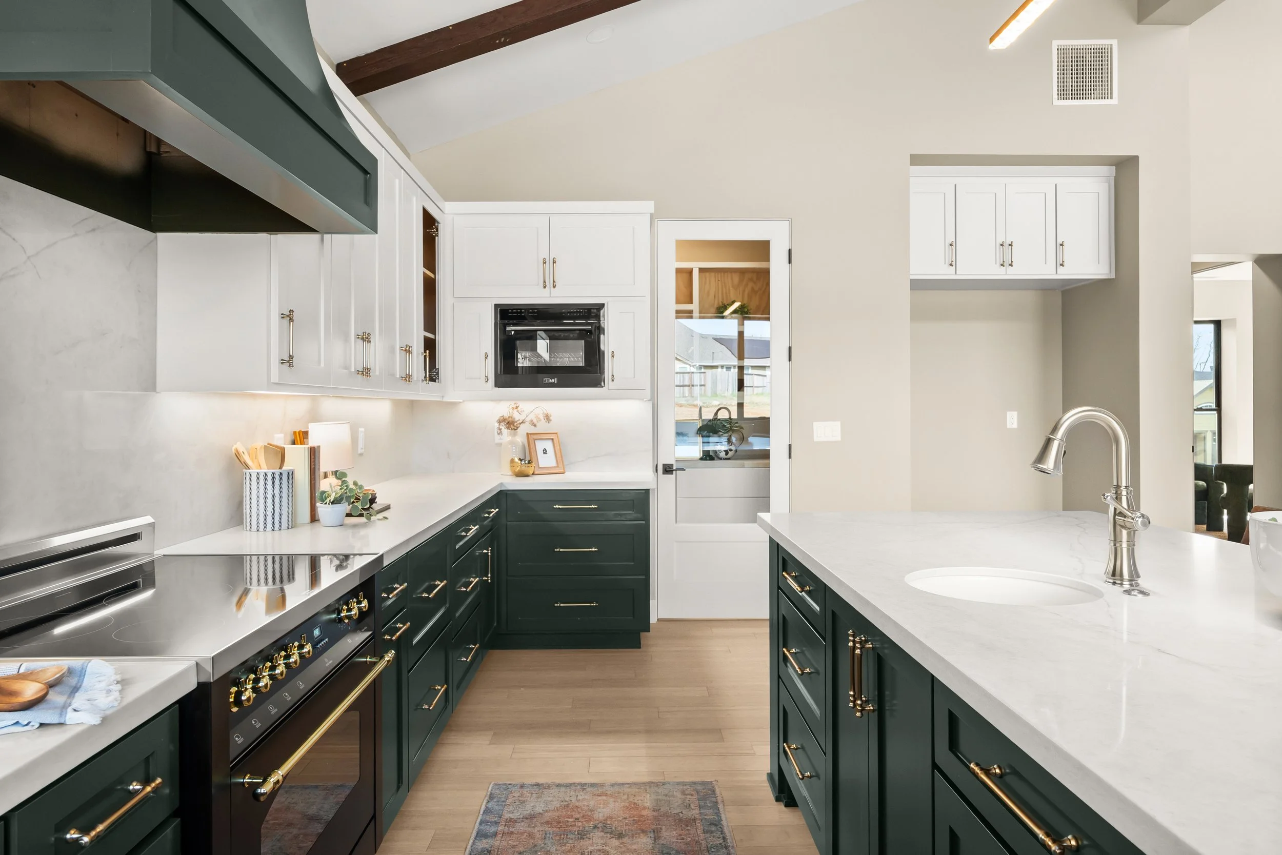 Custom cabinets and quartz countertop in 5093 Malibu Dr Reinforced Concrete Net Zero Home