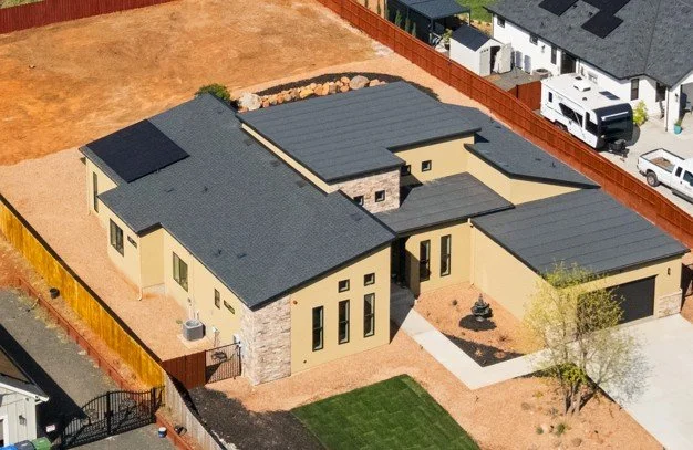 Fire resistant reinforced concrete home, Net Zero. Solar Panel demand is low. 4.2kw on 3358 sq ft due to the concrete system and design