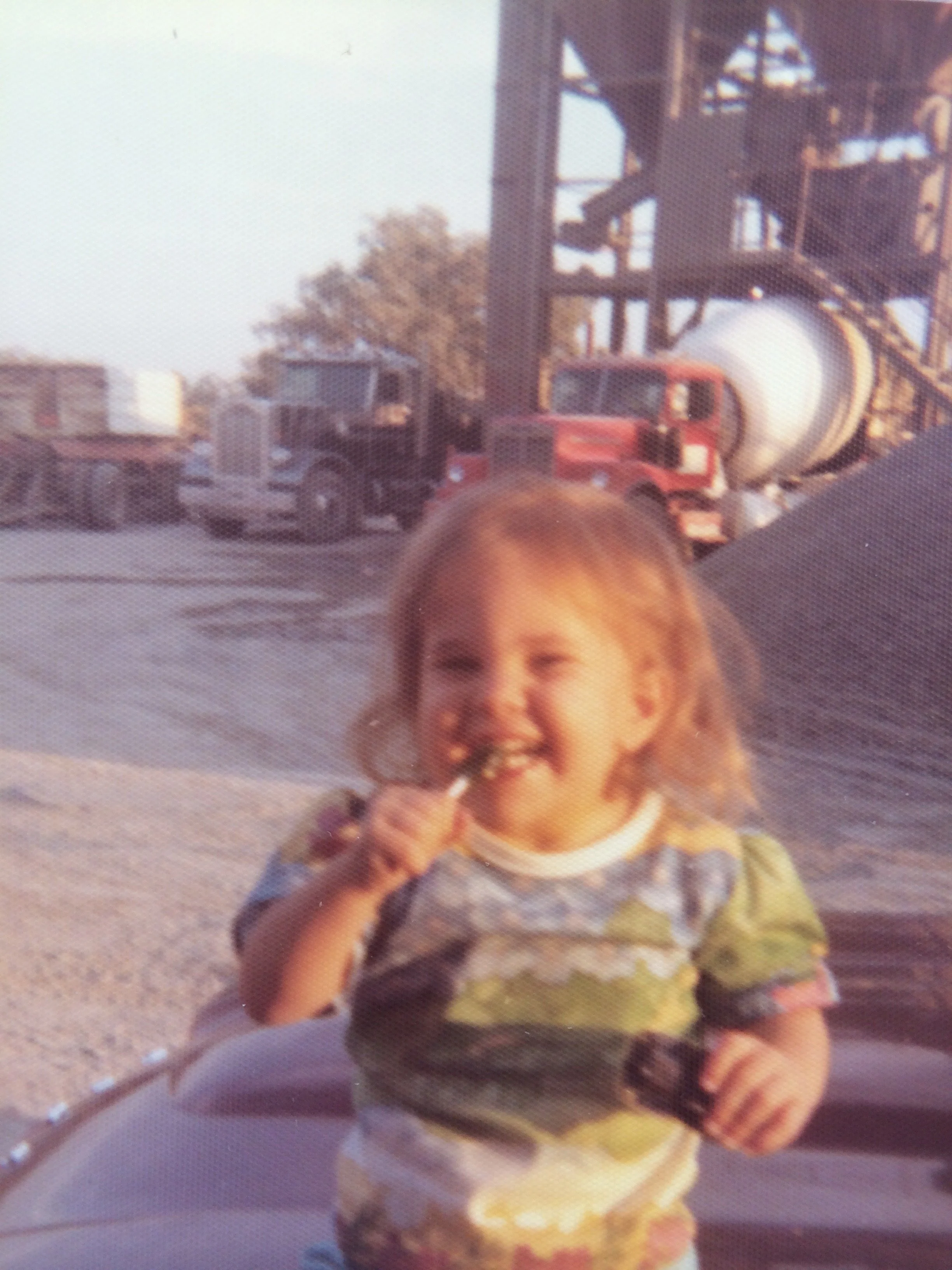 Jenny Mitchell as a child. Photographed at the family business, a ready mix concrete plant. Jenny grew up in the industry and has generational knowledge of how concrete reacts and performs.