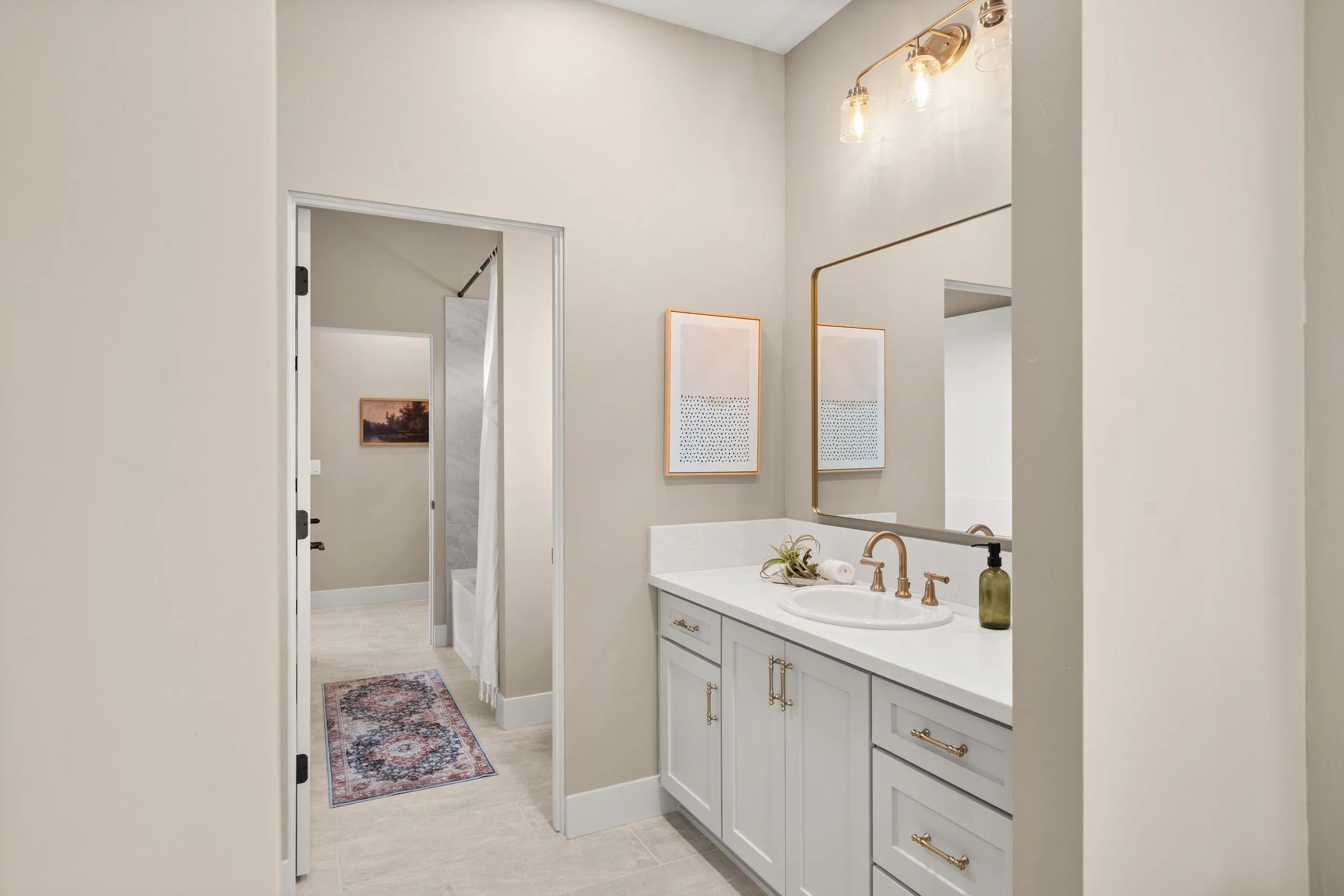 5093 Malibu Drive, Paradise, CA Bathroom 2 Jack & Jill. Tub/Shower. Custom Tile and Champagne Bronze Finishes. Bedroom 2 Connected Vanity. 