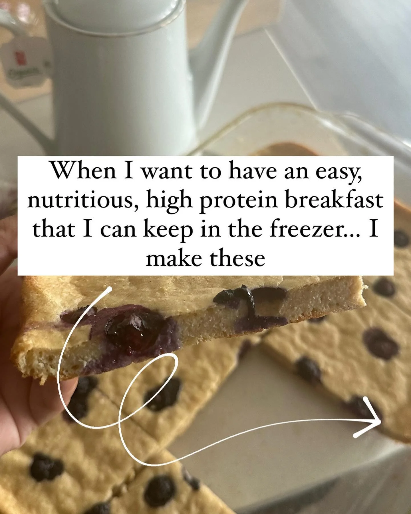 A baked oat bar topped with fruit spread cut diagonally, with a pitcher in the background and video text overlay reading "When I want to have an easy, nutritious, high protein breakfast that I can keep in the freezer... I make these".