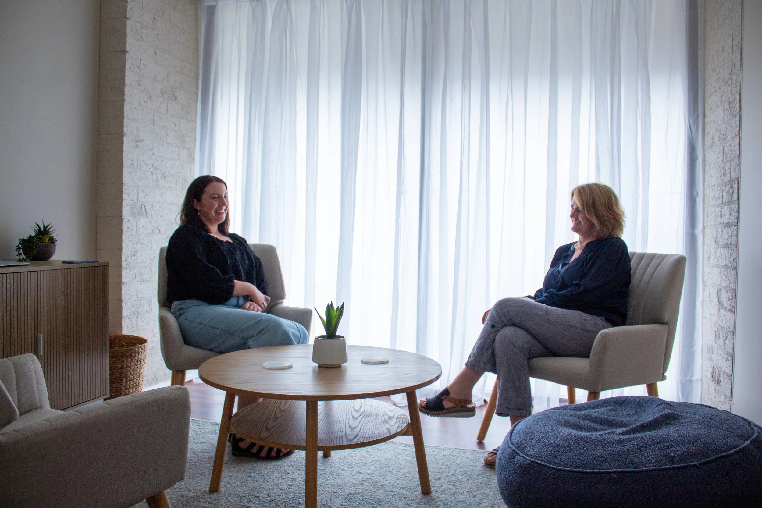 Two females in a therapy session.