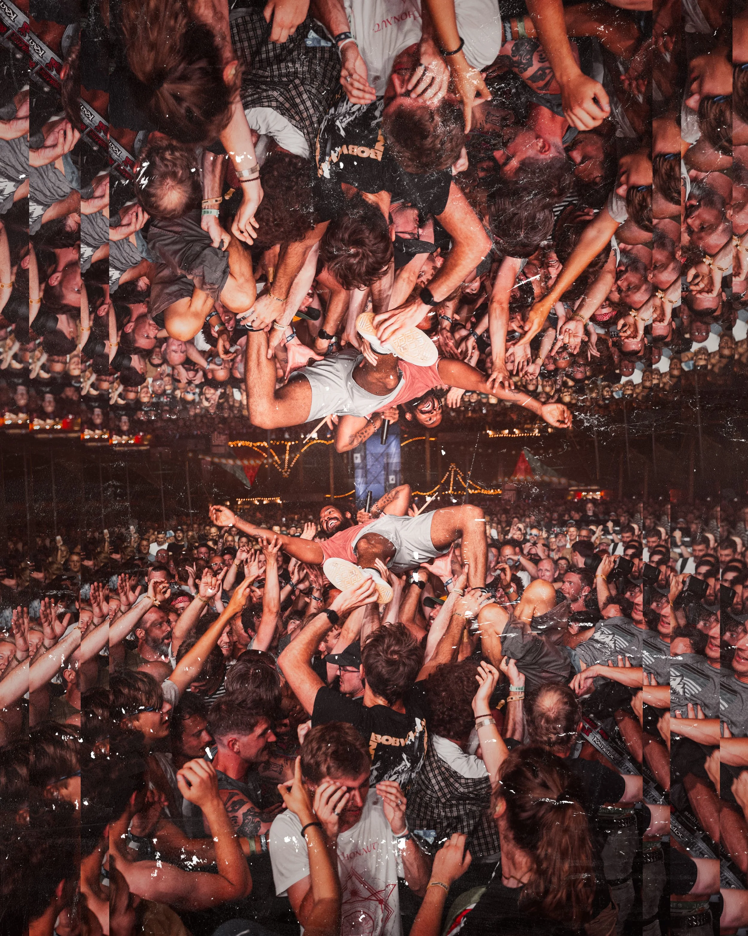 A lively concert scene with crowd surfing people, a band performing on stage, and an audience raising their hands in excitement at night.