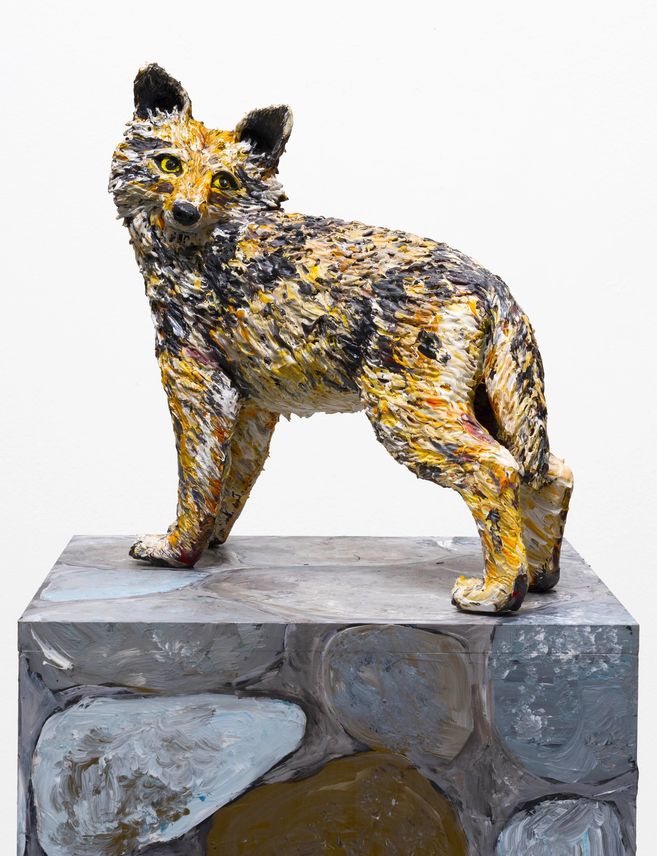 An abstract sculpture of a dog, painted with thick, textured brushstrokes in various colors, standing on a painted base.